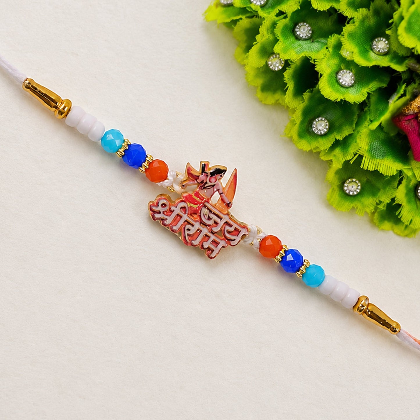 Lord Ram Designer Rakhi adorned with colorful beads for Raksha Bandhan