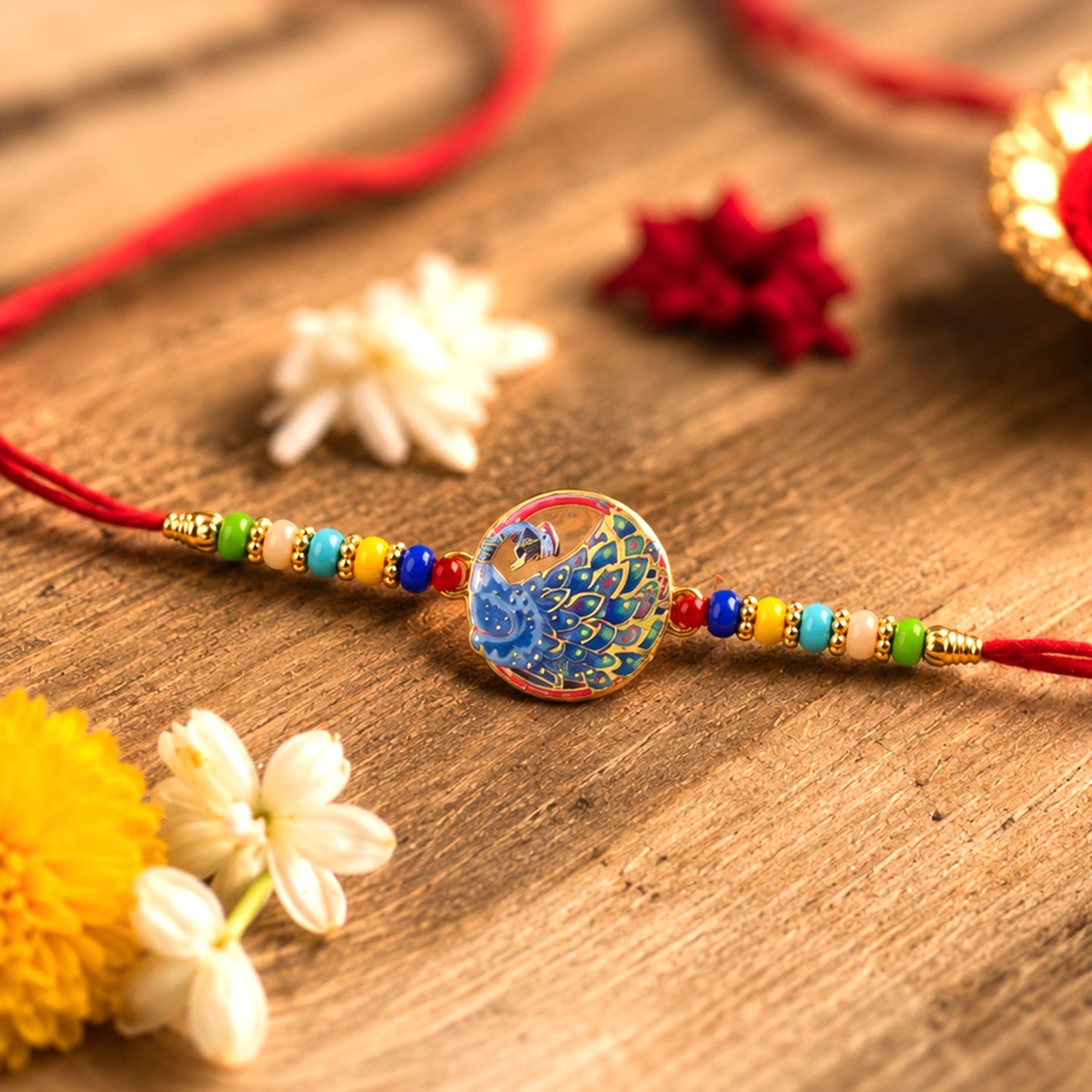 Close-up of a Peacock Rakhi featuring vibrant multicolor beads.