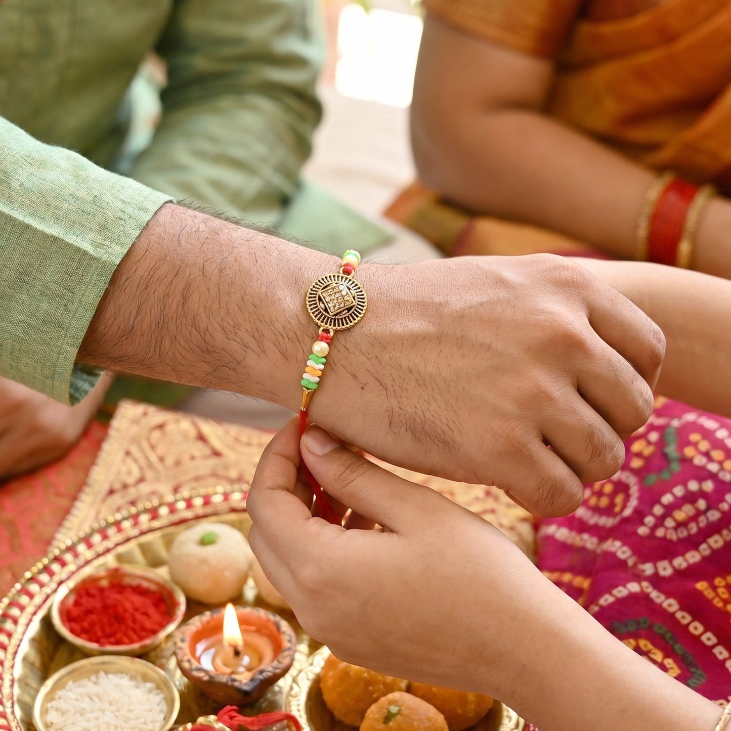 Side angle of Bhabhi Rakhi highlighting coin clasp and bead work