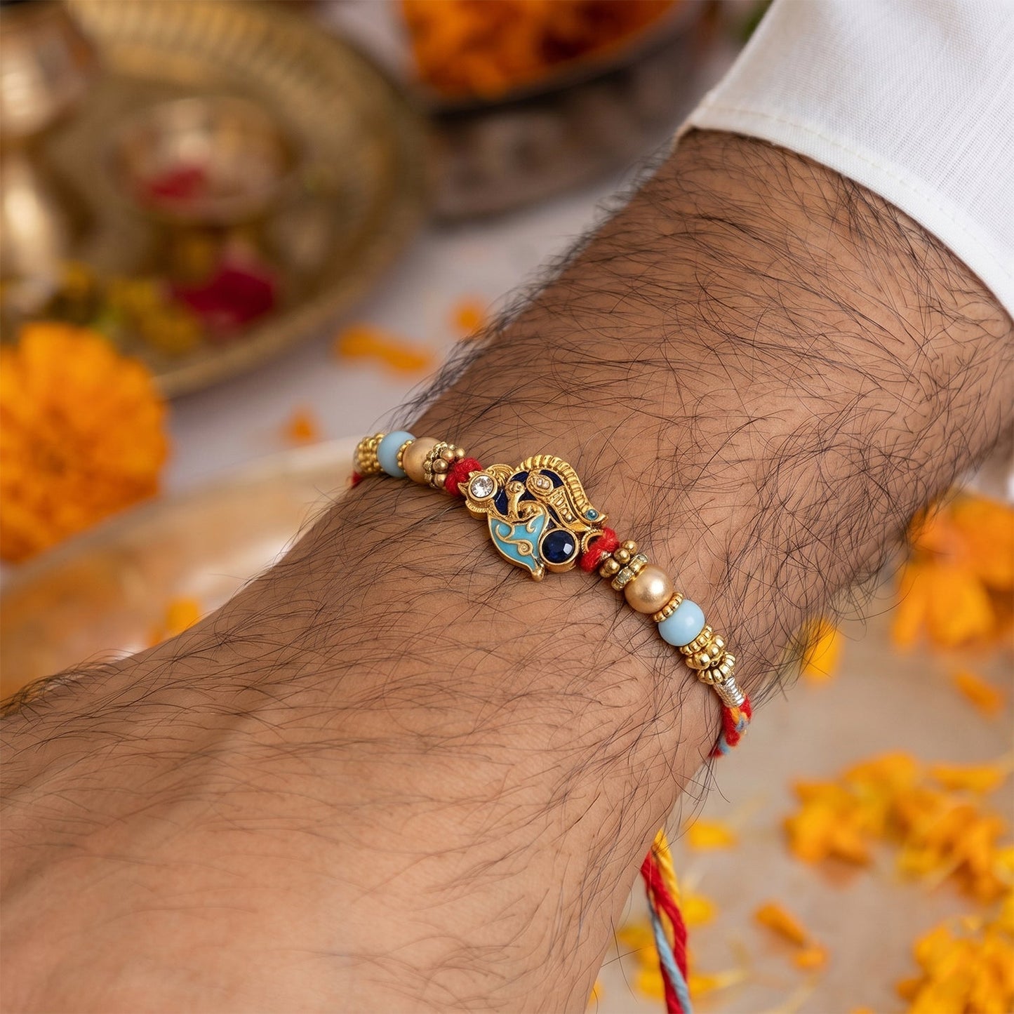 Close-up of pearl beads and colorful Latkan on Bhabhi Rakhi