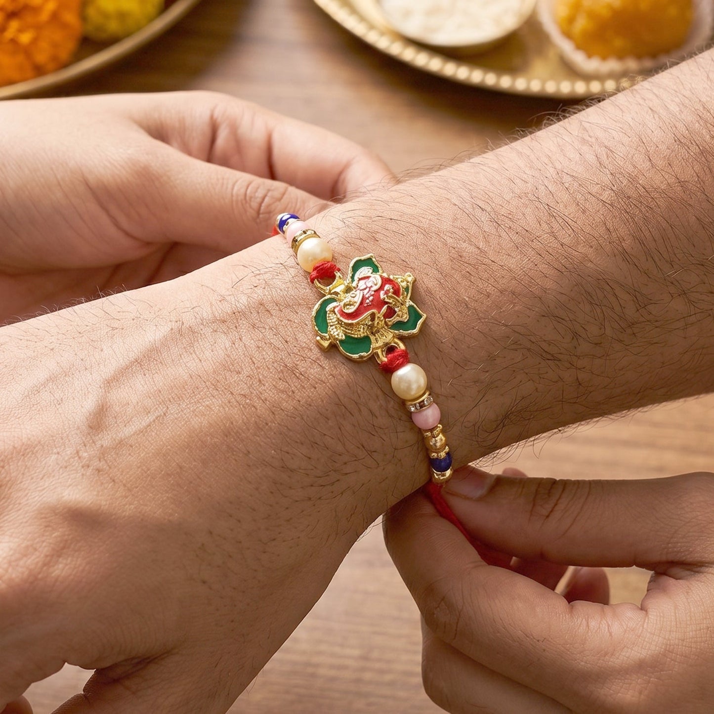 Top view of intricate bead work on Floral Peacock Bhabhi Rakhi