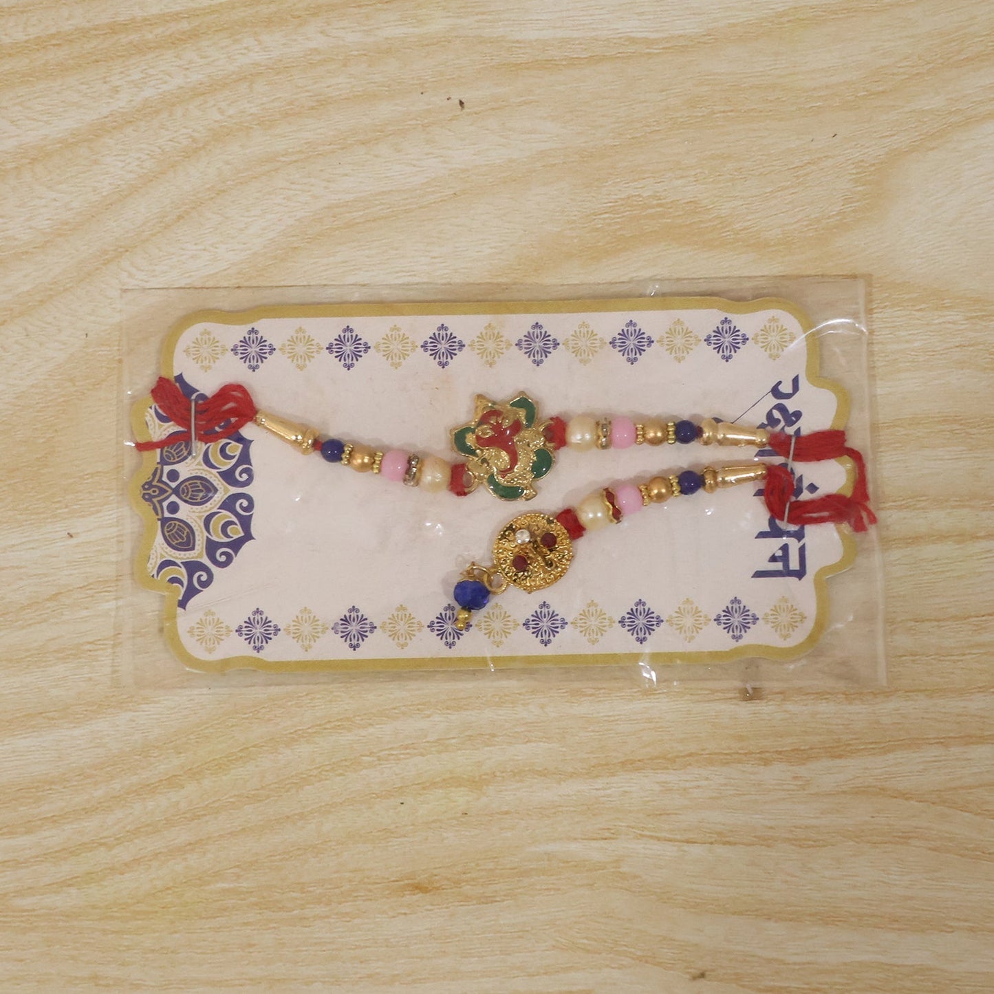 Bhabhi Rakhi with pastel bead embellishments and floral design