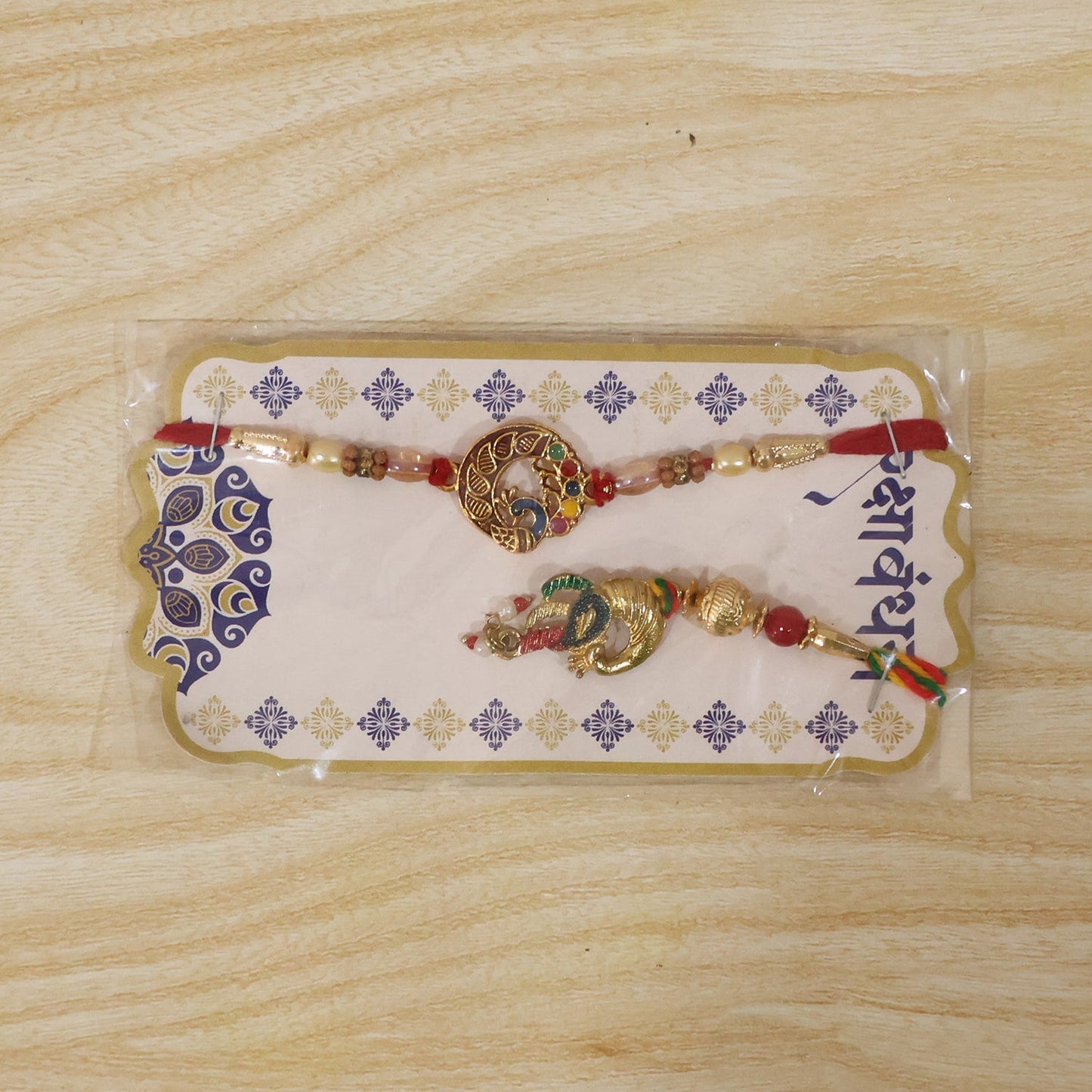 Decorative Peacock Charm Bhabhi Rakhi in packaging