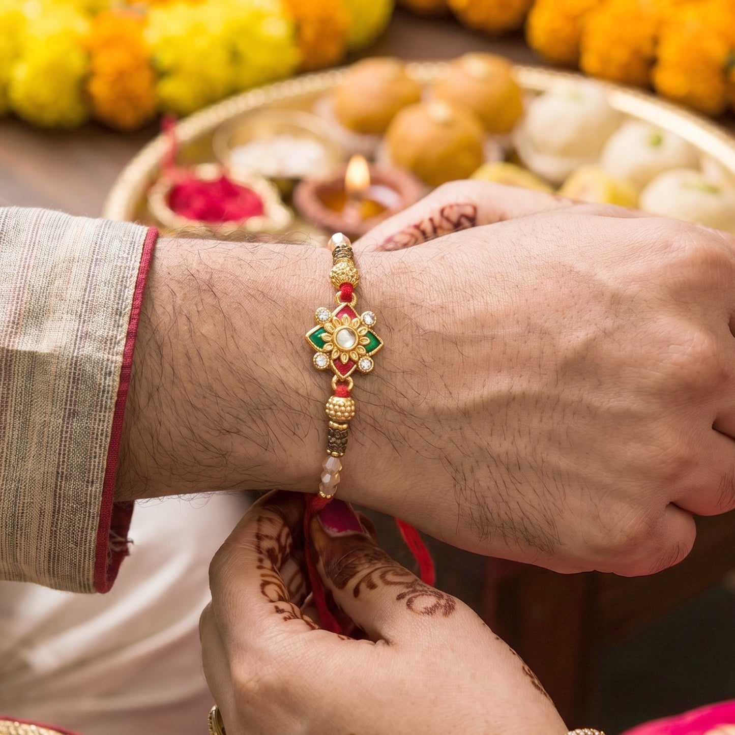 Close-up of intricate golden latkan on Floral Pearl Bhabhi Rakhi