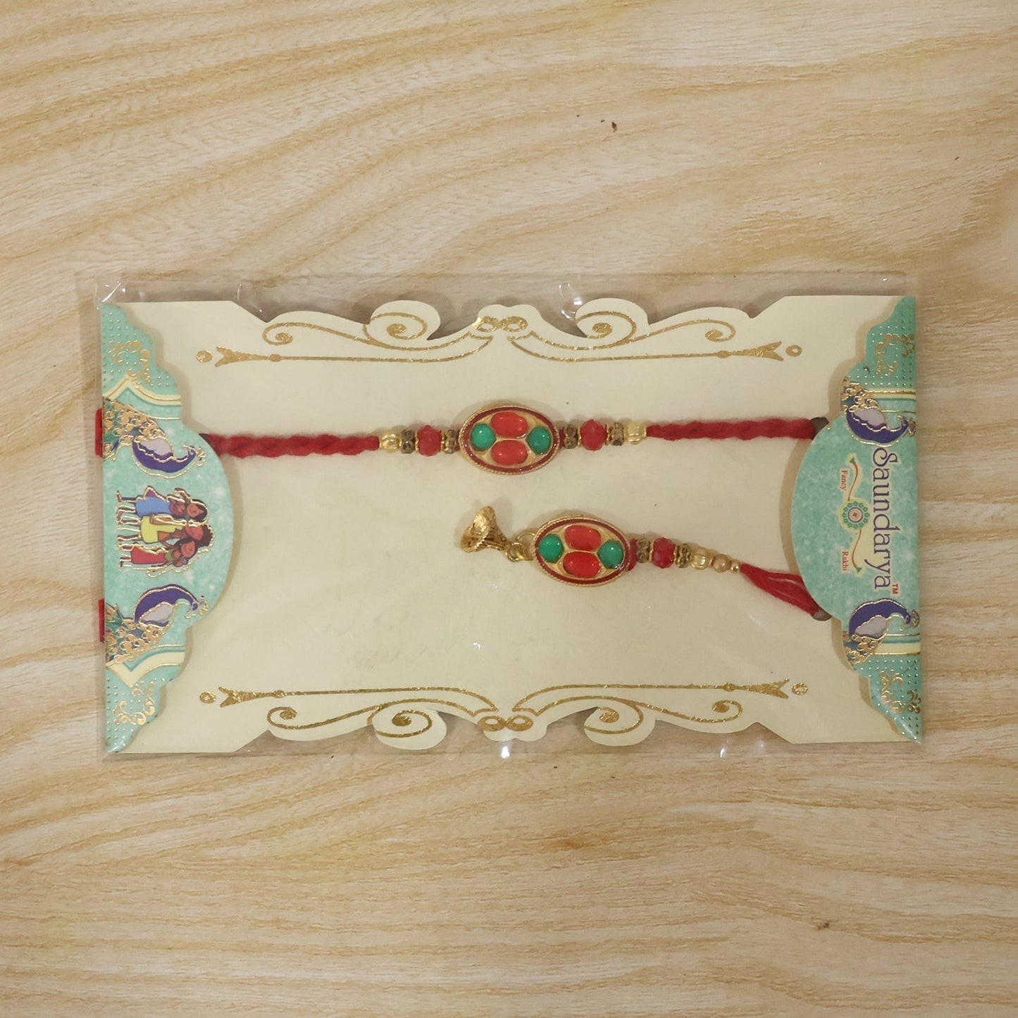 Complete oval stone Bhabhi Rakhi with gold tone latkan and thread