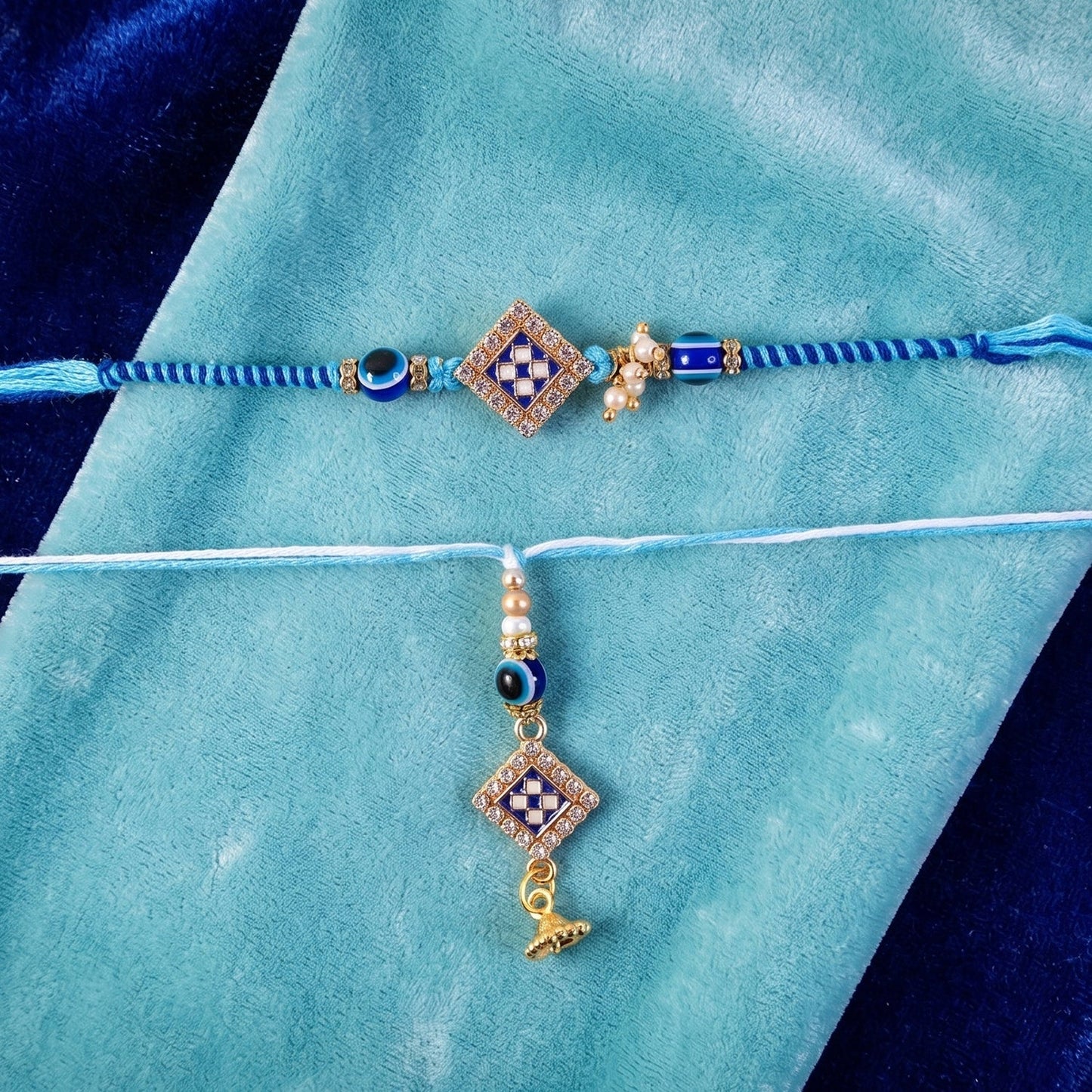 Close-up of pearl twin charm on Bhabhi Rakhi emphasizing craftsmanship