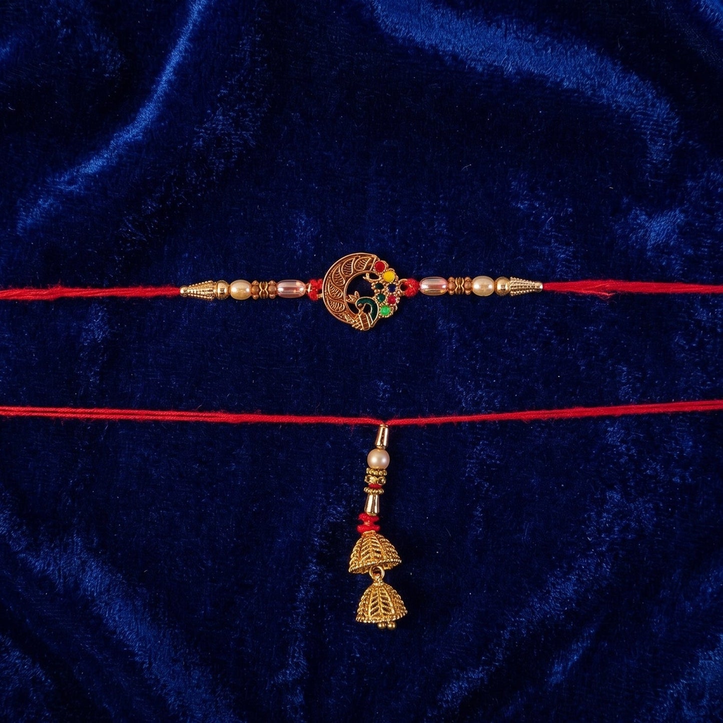 Festive styled Peacock Motif Bhabhi Rakhi with pearl embellishments.
