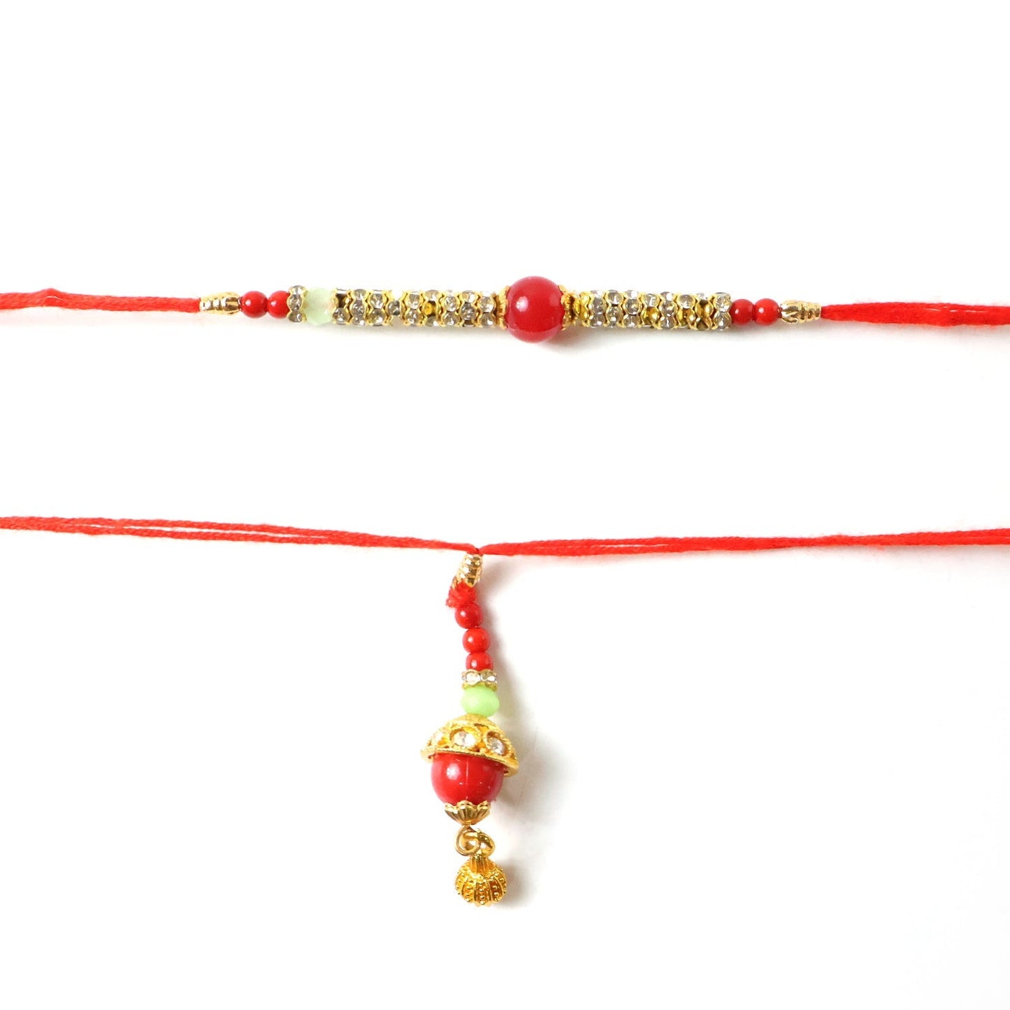 Detail of gold charm on red pearl Bhabhi Rakhi