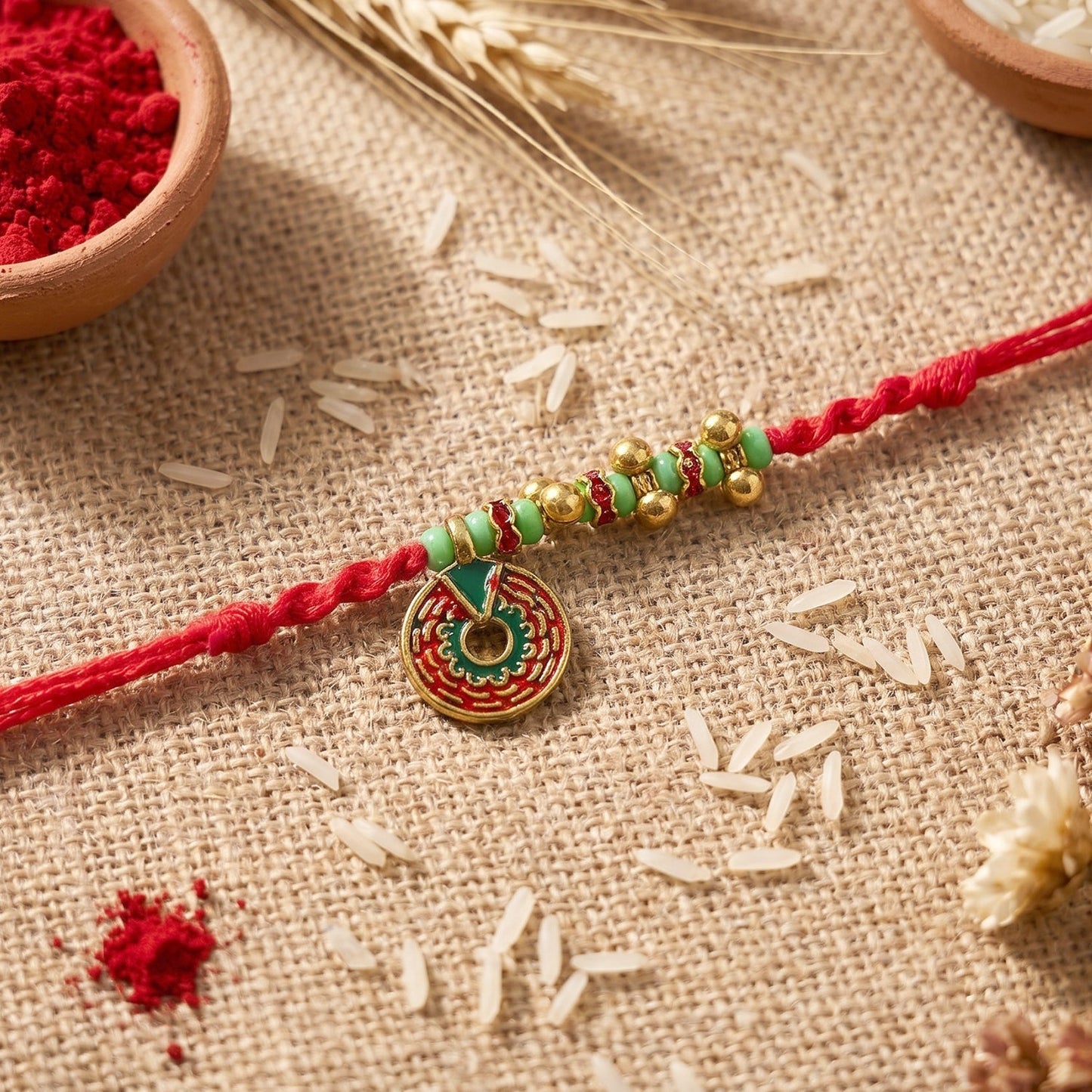 Close-up of pearl details on floral stone Bhabhi Rakhi