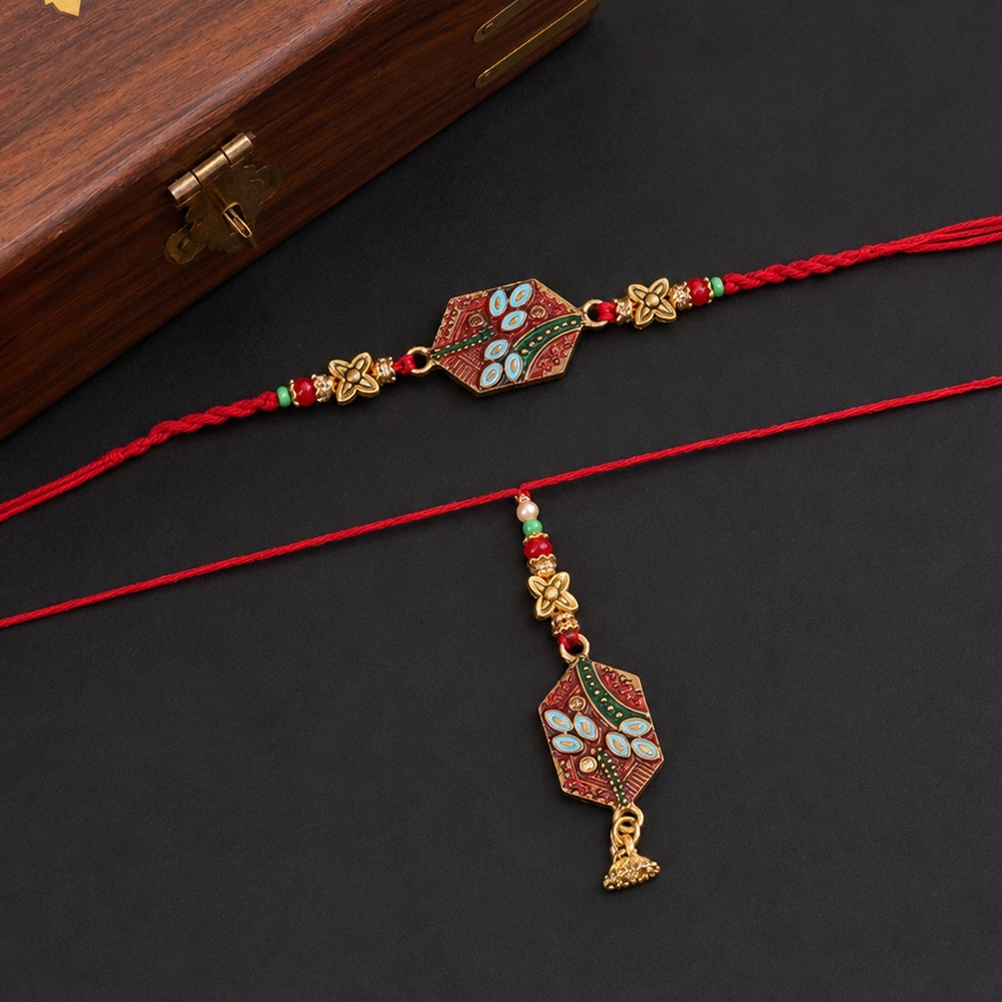 Meenakari Pot Bhabhi Rakhi with gold Latkan, front view displaying intricate design