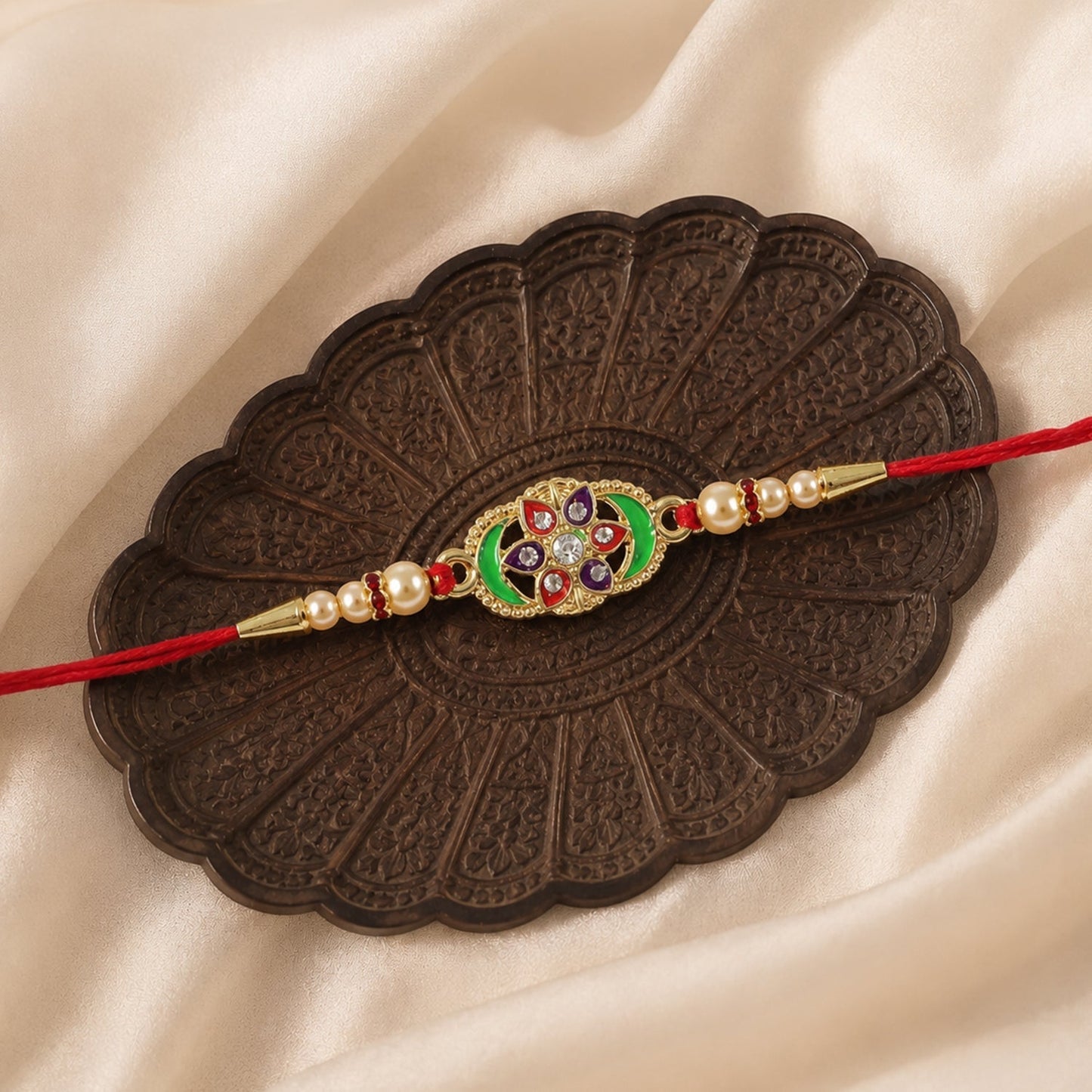 Soft threaded Rakhi with floral and pearl design