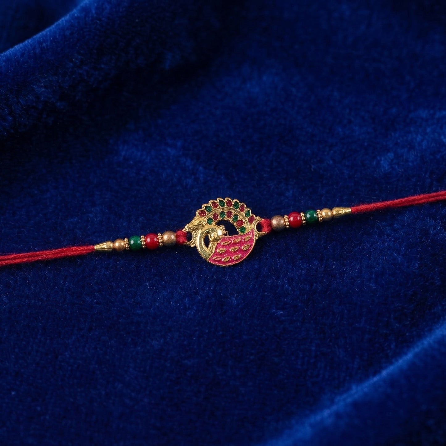 Pink Peacock Rakhi showing thread detail and design