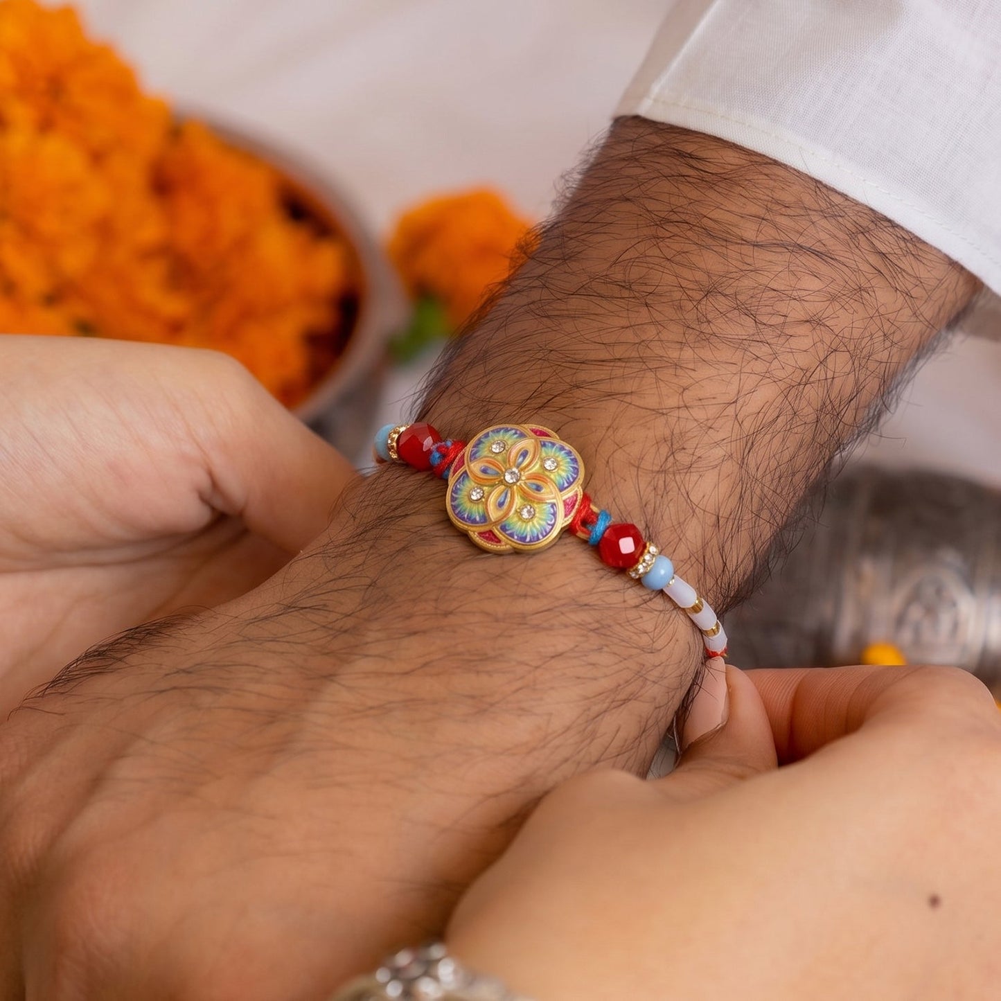 Close-up of multicolor floral Rakhi beads and centerpiece