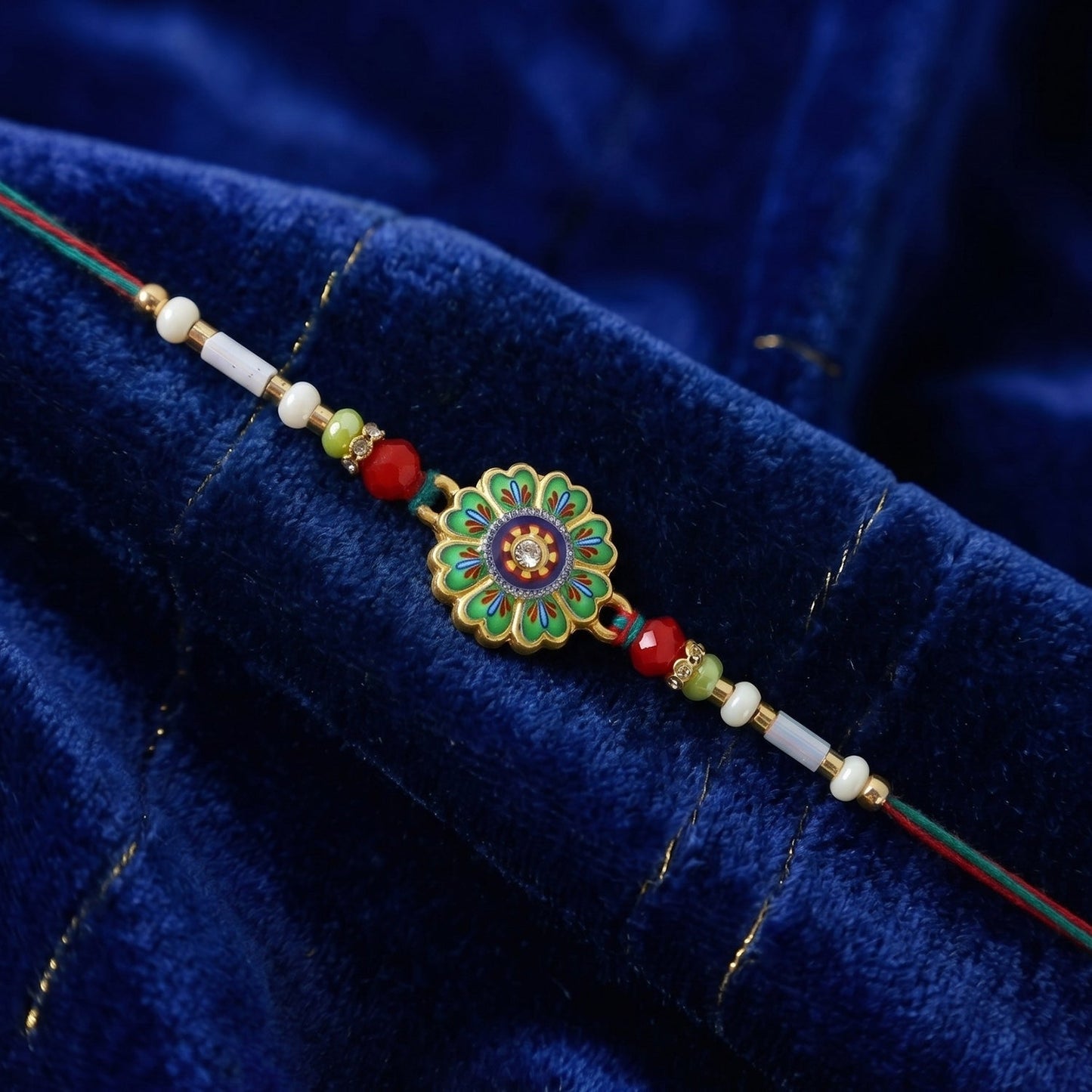 Detailed view of colorful beads on floral round rakhi