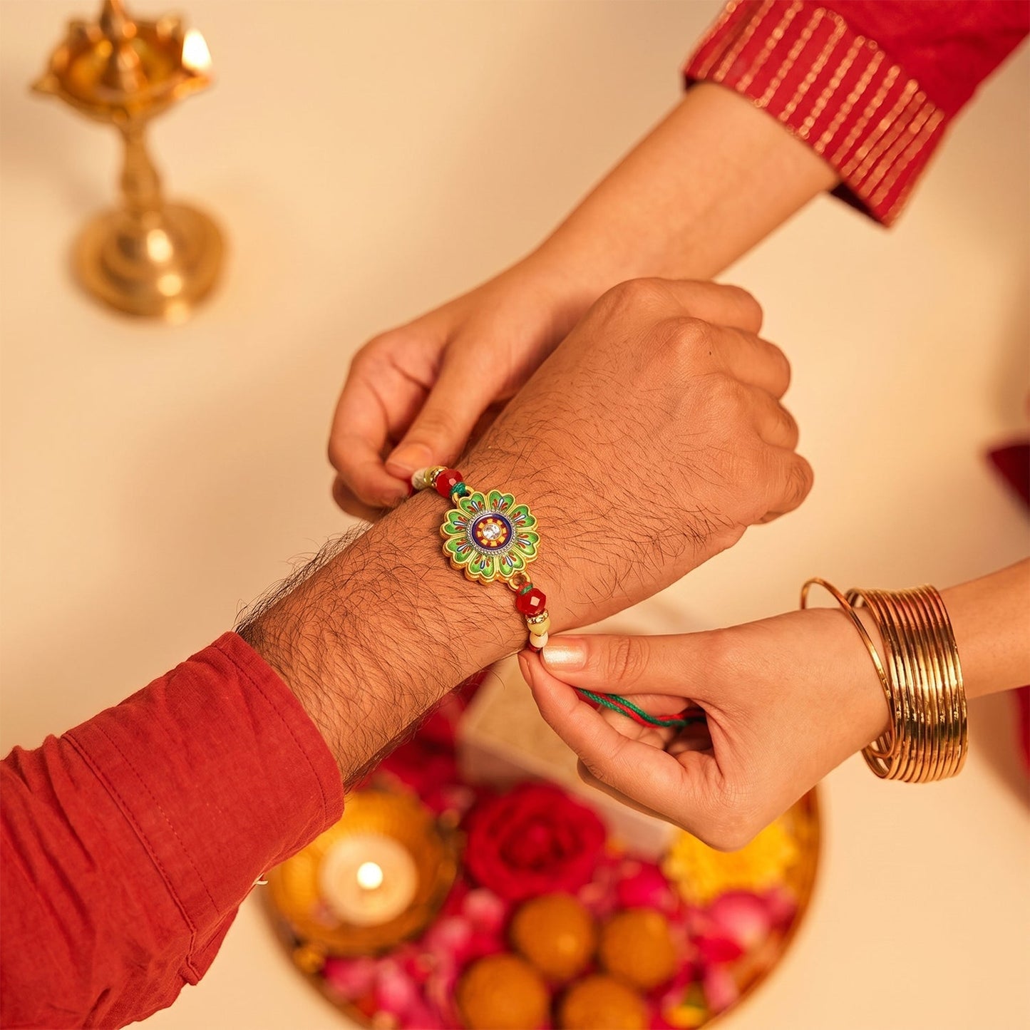 Close-up of floral round rakhi centerpiece with beads