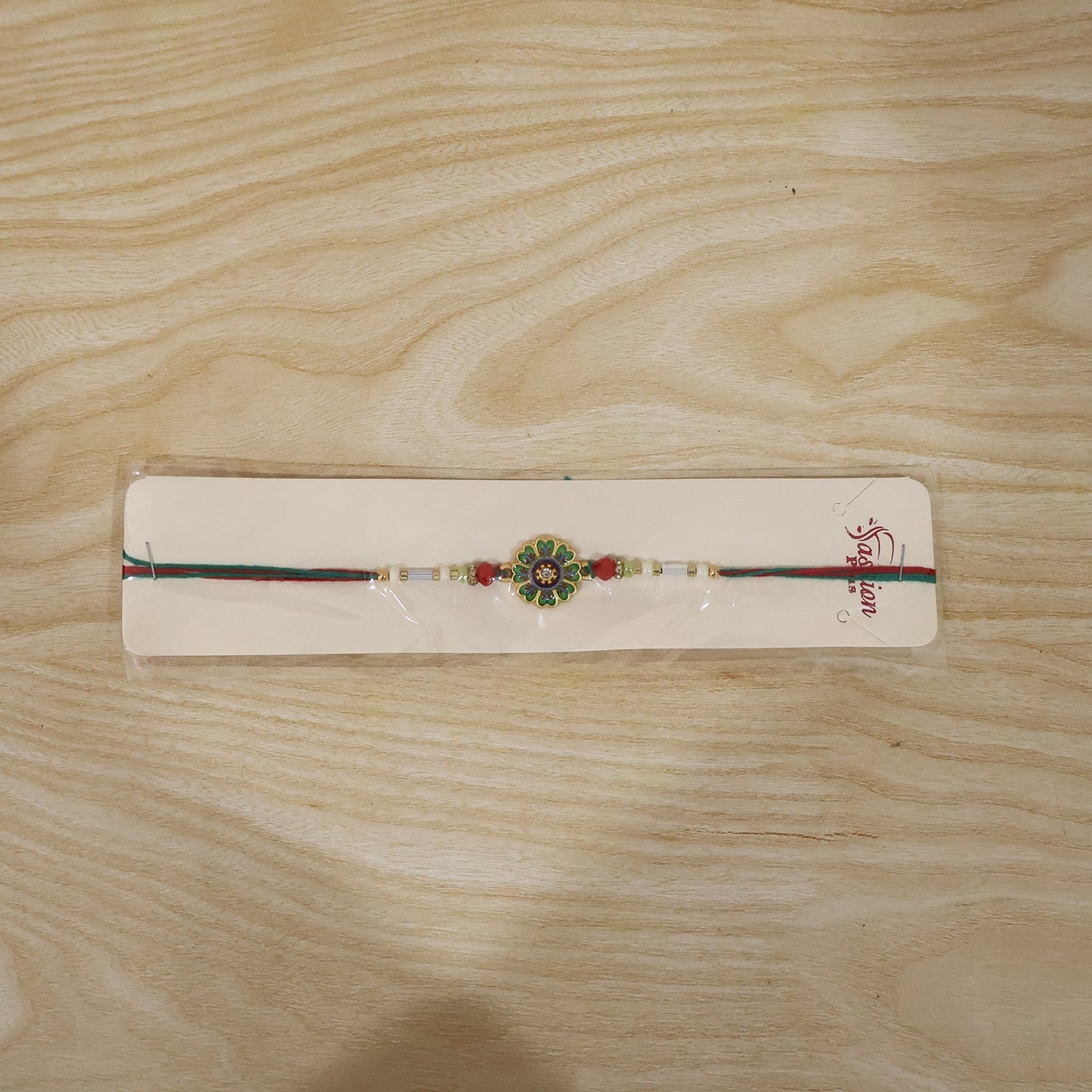 Traditional floral round rakhi with soft tying thread
