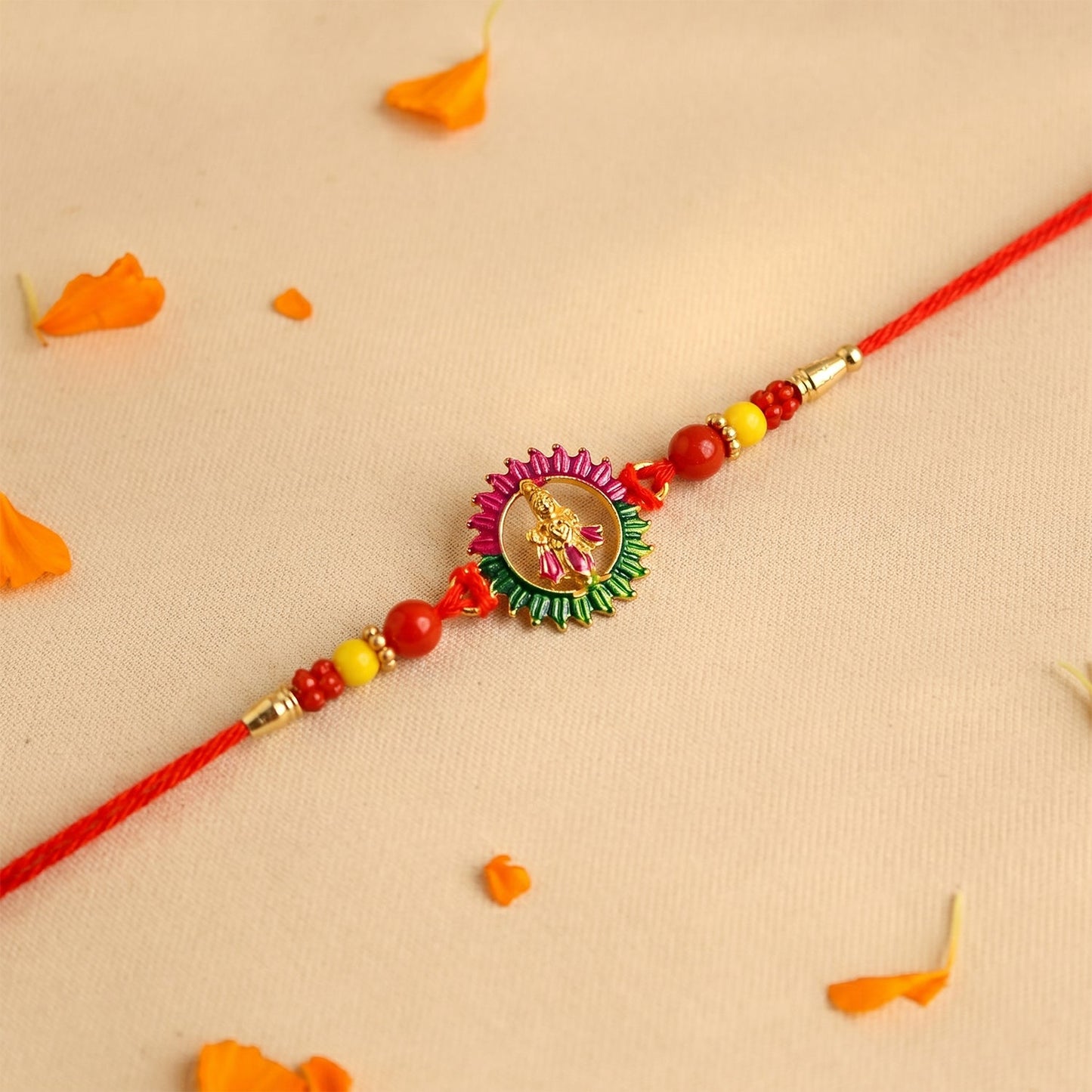 Close-up of detailed beadwork on traditional Rakhi