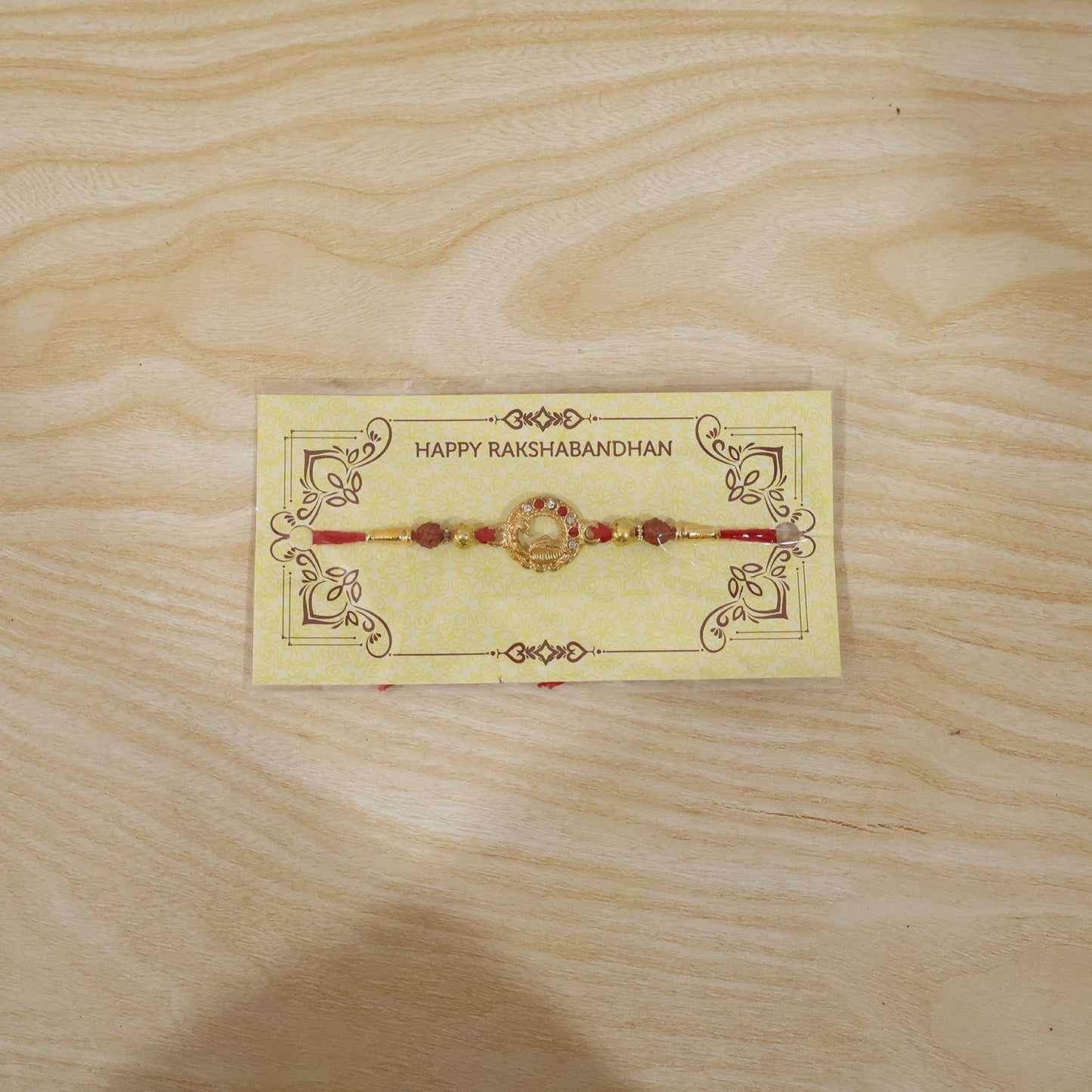 Rakhi arranged for Raksha Bandhan with elegant peacock motif