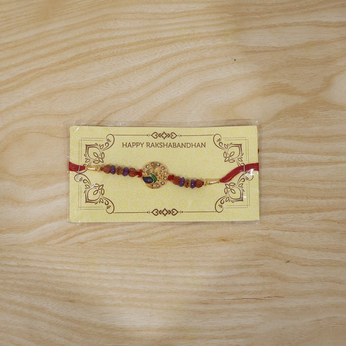 Complete Peacock Rakhi with decorative elements for Raksha Bandhan