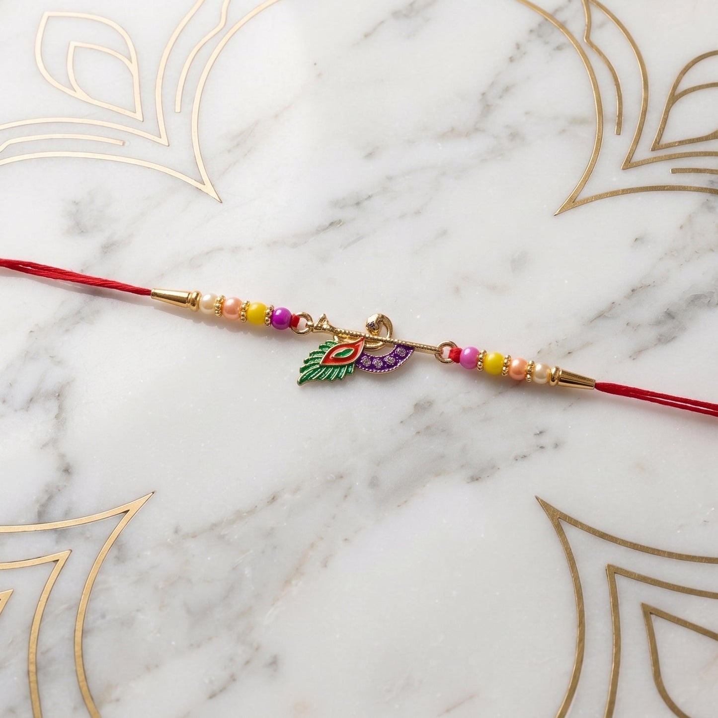 Decorative Peacock Feather Flute Rakhi with beads and thread