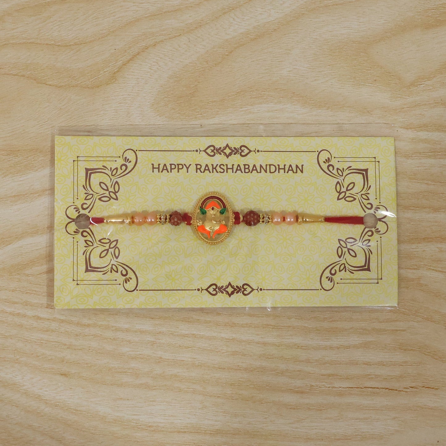 Elegant Ganesh Rakhi with decorative beads for Raksha Bandhan
