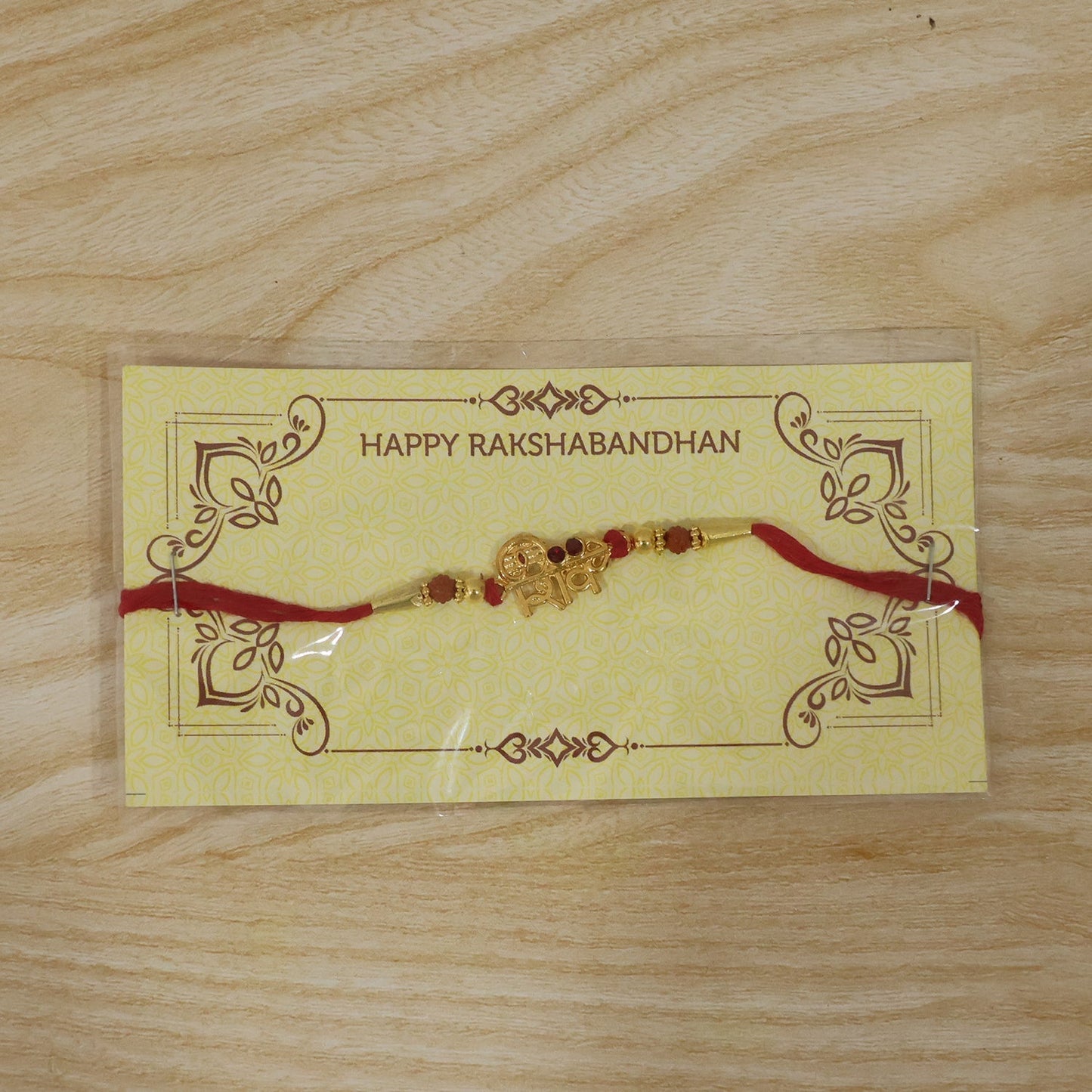 Complete Shiv Design Rakhi laid out displaying thread and beads