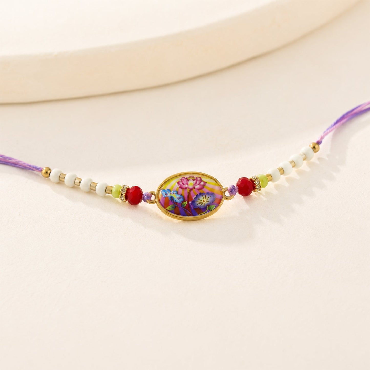 Side view of floral designer Rakhi showing floral design and thread