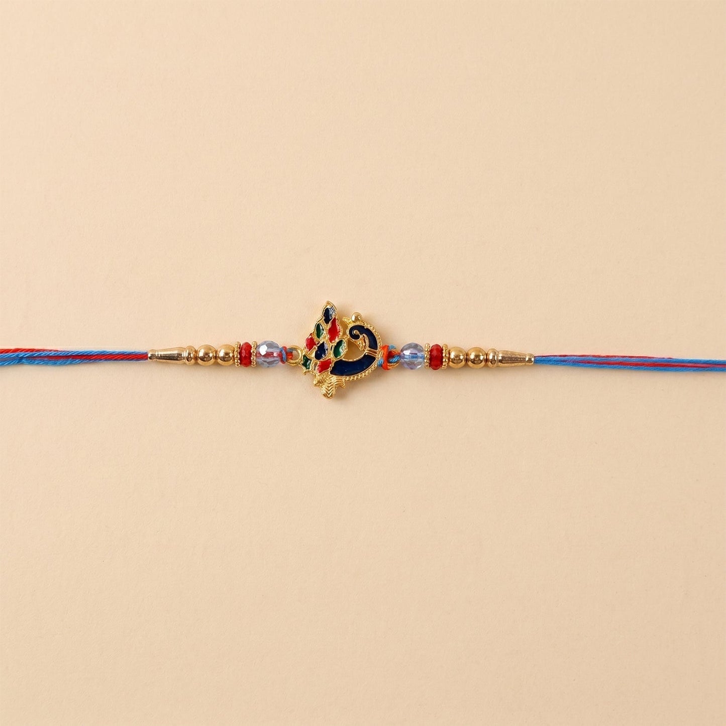 Detailed look of beads and threads on peacock rakhi