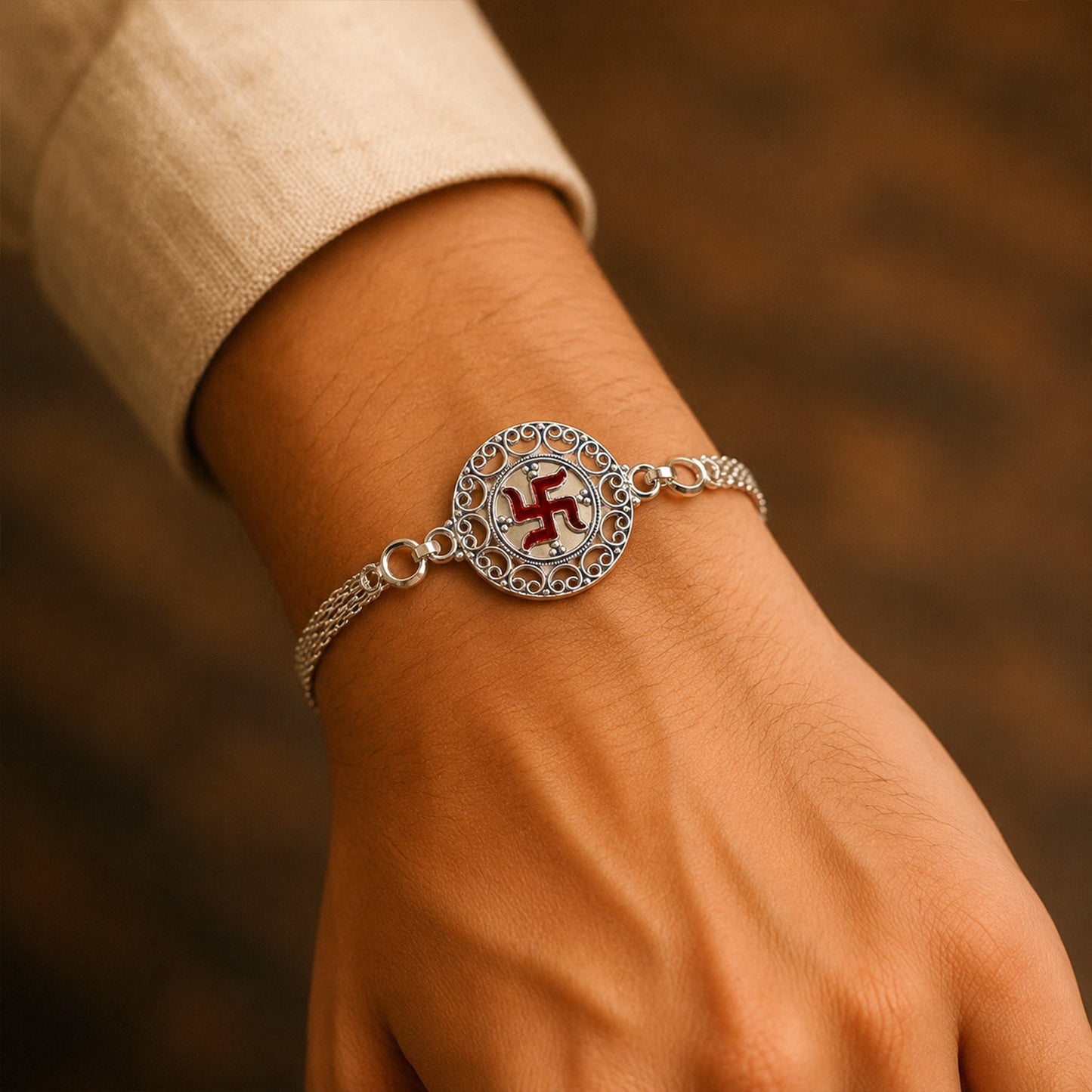 Close-up of Silver Swastik Chain Rakhi detail