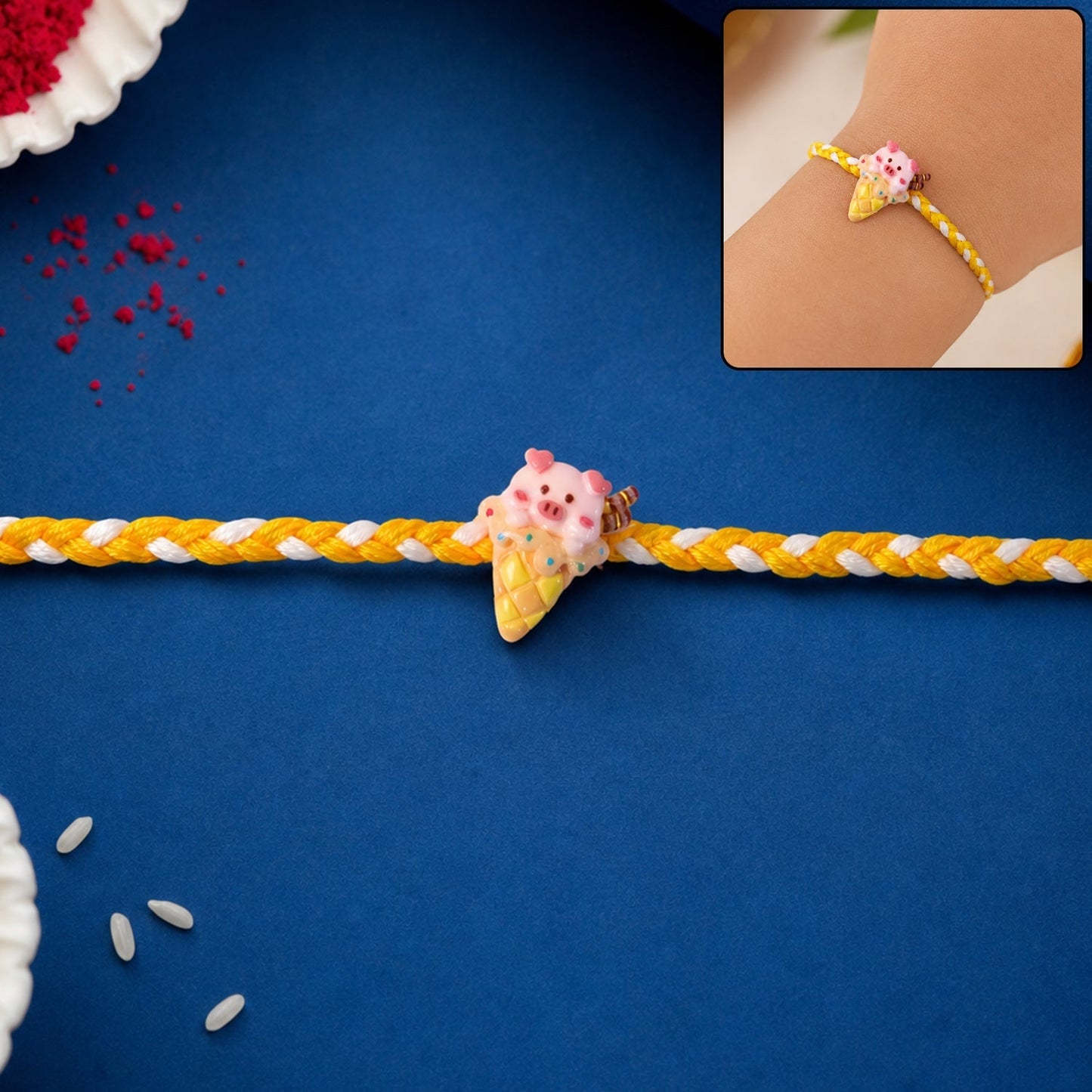 Front view of the Cute Pig Rakhi, showcasing its vibrant colors and design.