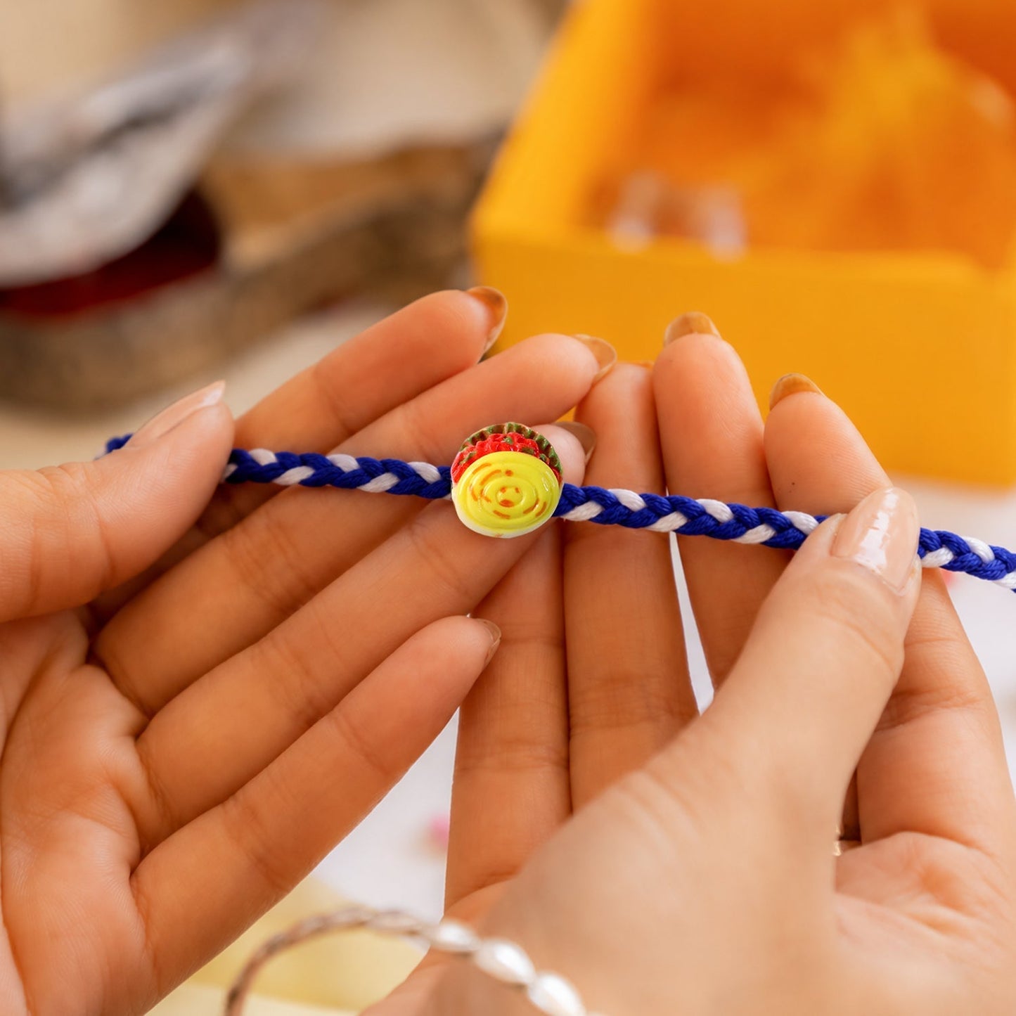 Designer threads on Yellow Sweet Dessert Dori Rakhi