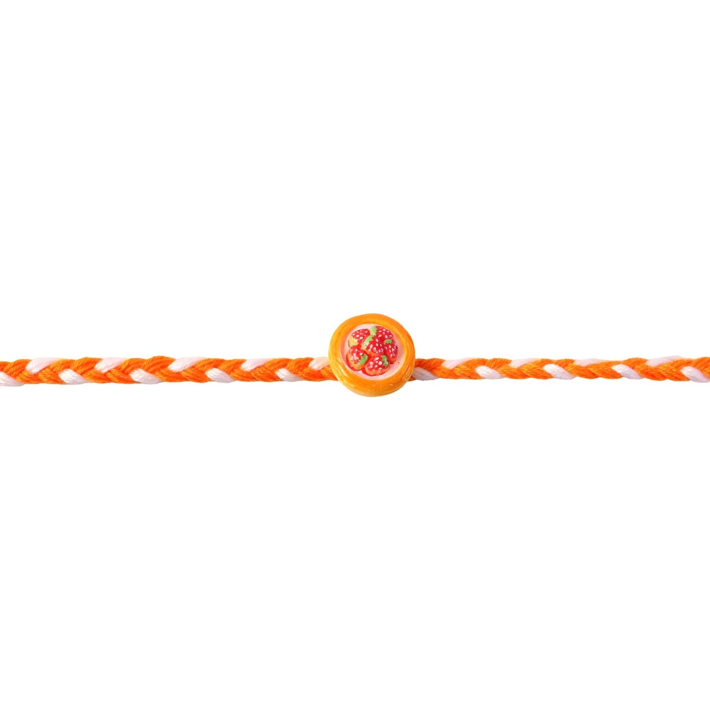 Hand holding a charming strawberry Dori Rakhi