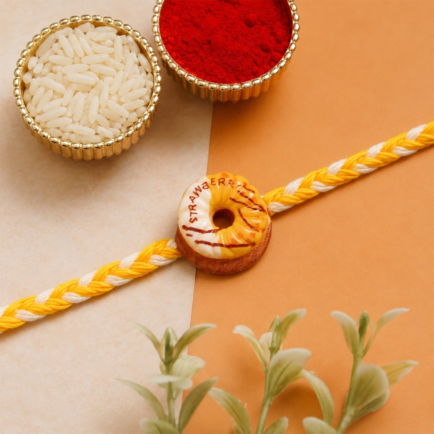 Donut charm rakhi styled on hand for festive look