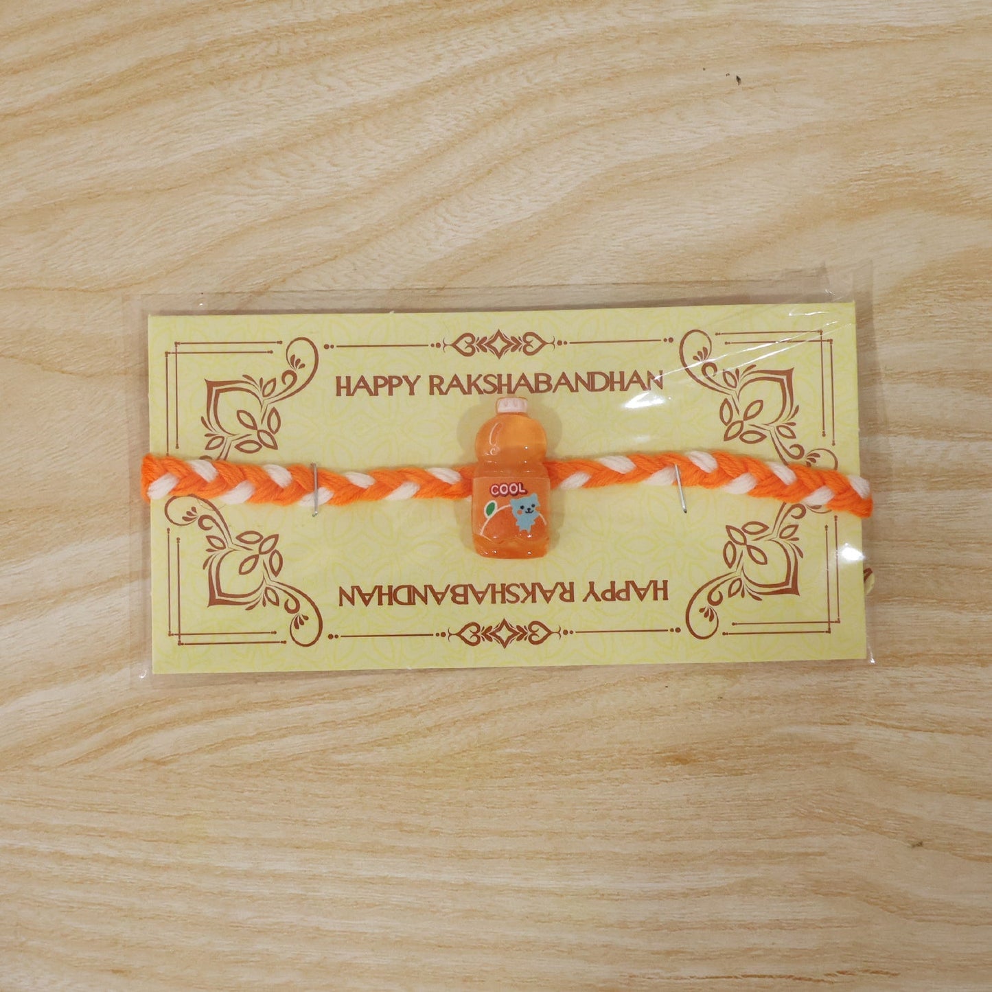 Rakhi tied on white surface showing its trendy design