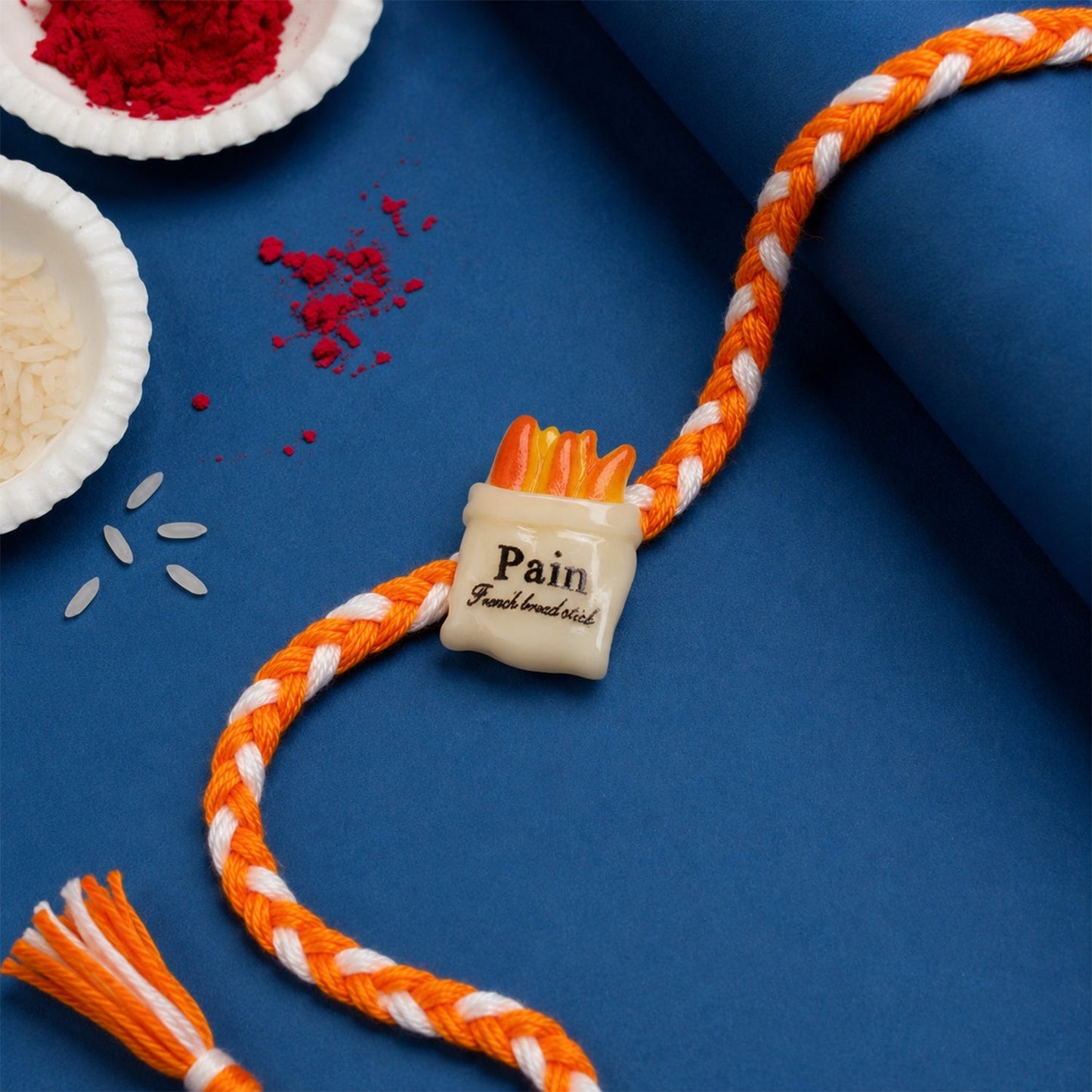 Elegant rakhi for brother with stylish food-themed festive design