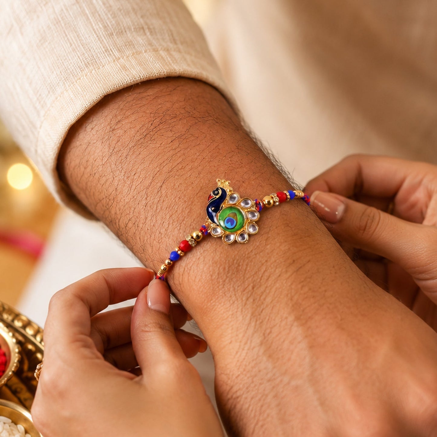 Side view of Peacock Feather Charm Rakhi showing bead details