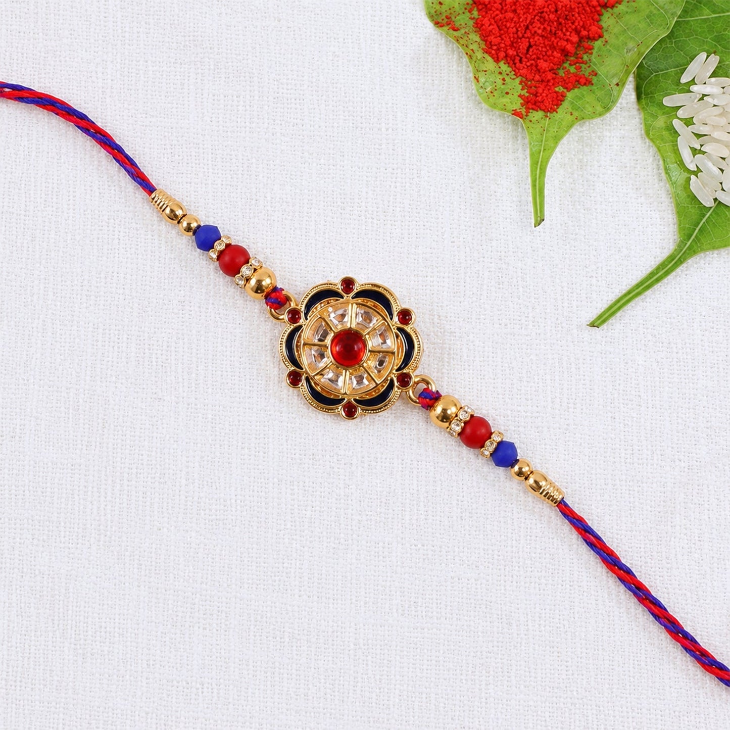 Side view of floral rakhi with string and bead decorations
