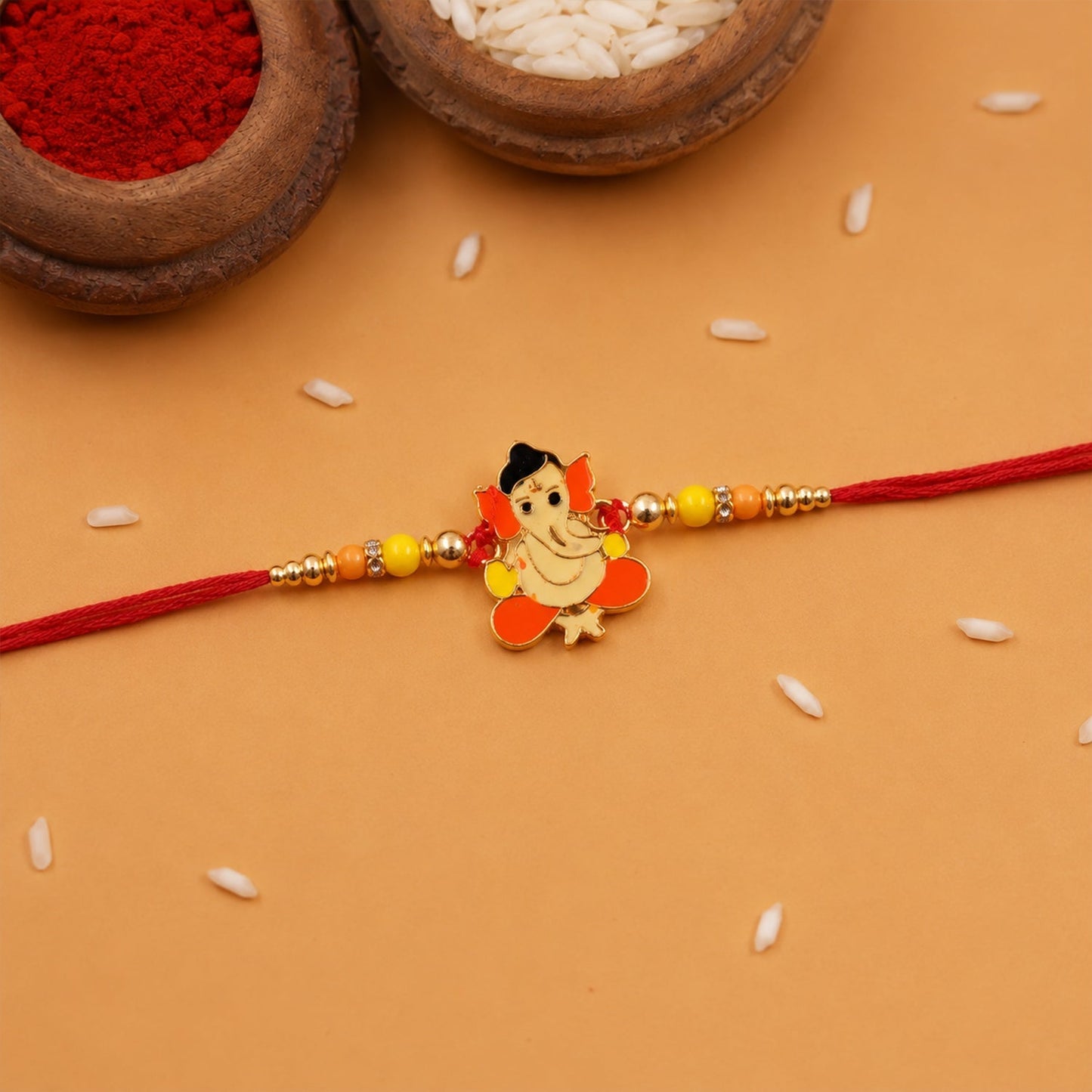 Side view of divine idol rakhi with decorative beads