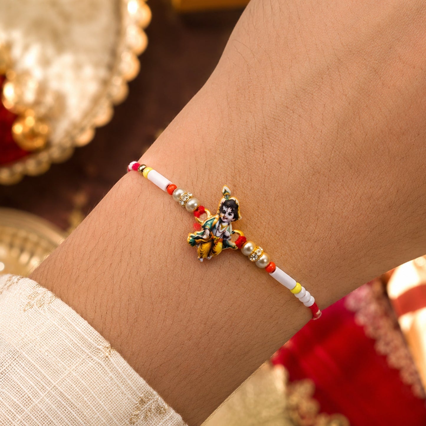 Side view of Krishna Idol Beads Rakhi showing delicate craftsmanship