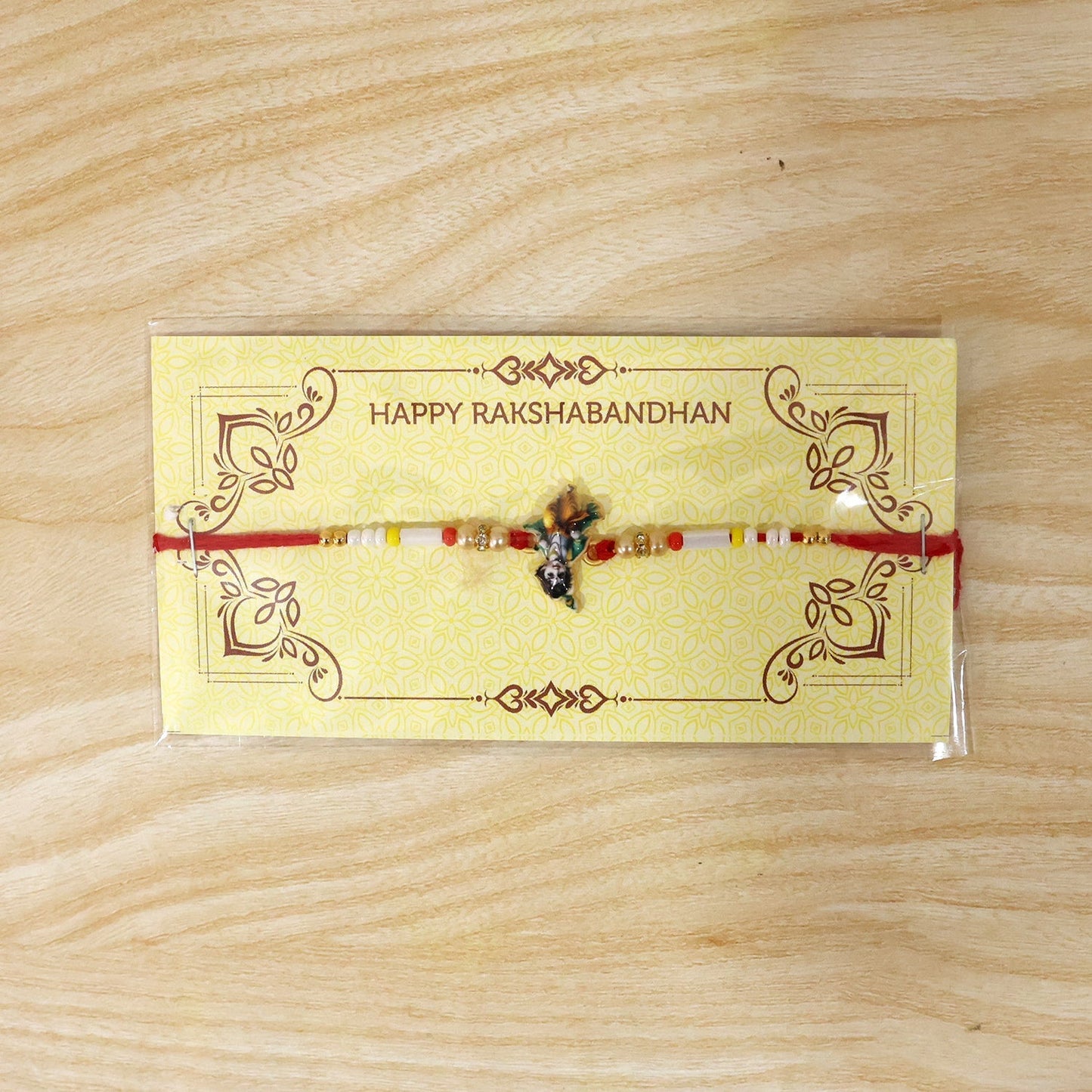 Full display of Krishna Idol Charm Beads Rakhi, festive and vibrant