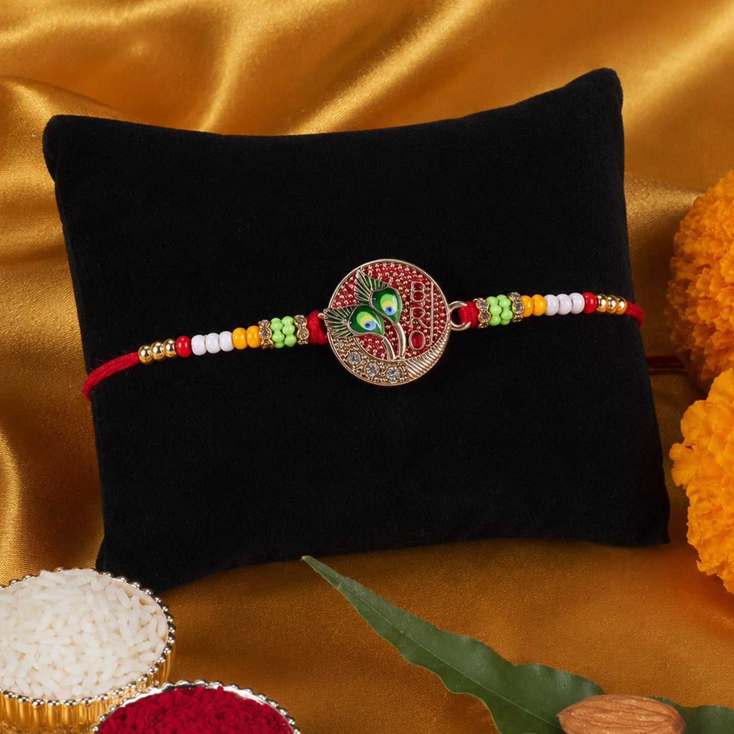 Elegant peacock feather rakhi displayed on white surface