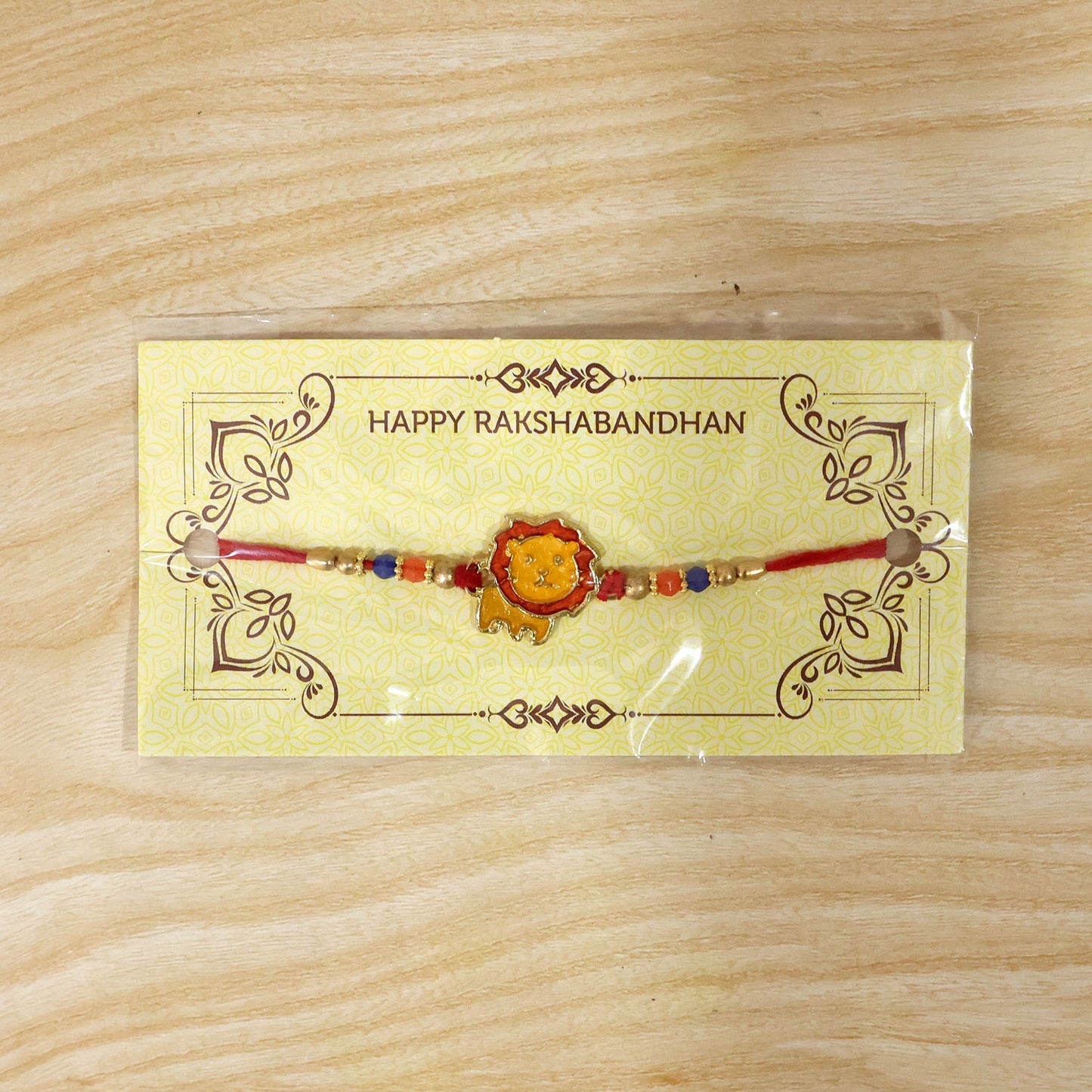 Detailed view of lion bead rakhi and thread craftsmanship