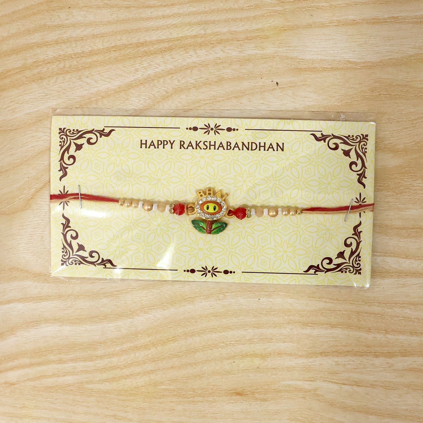 Detail of the elegant design of Smiley Flower Charm Rakhi
