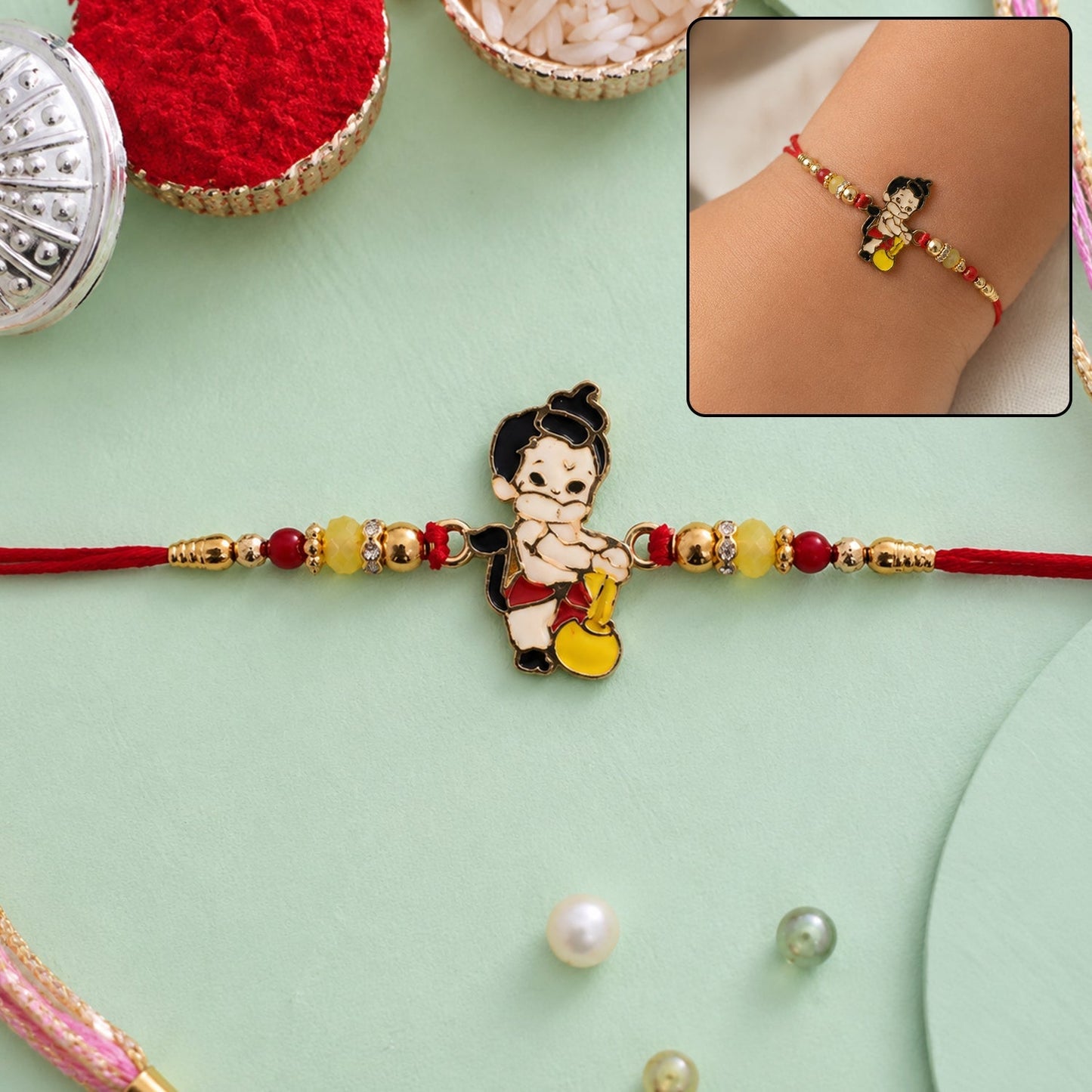 Close-up of Bal Hanuman Gada charm designer Rakhi with traditional design
