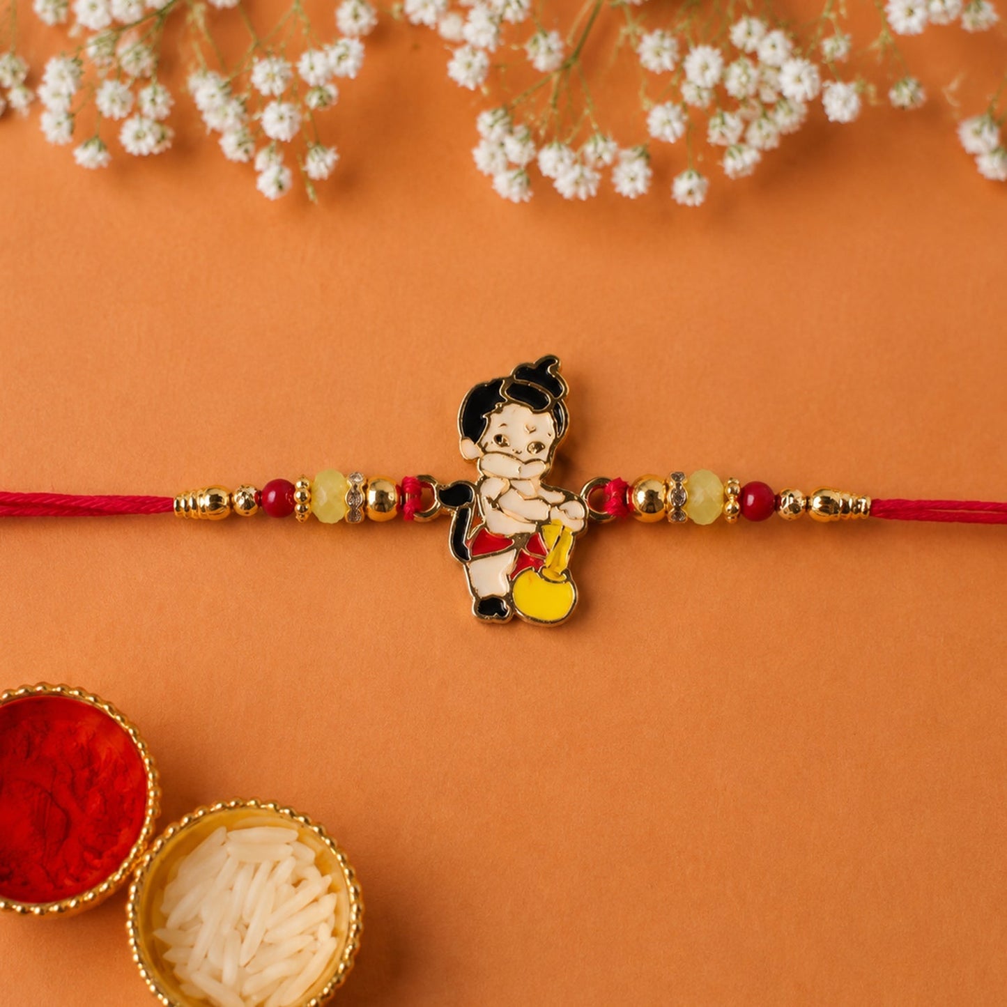 Top view of Bal Hanuman Rakhi with Gada charm