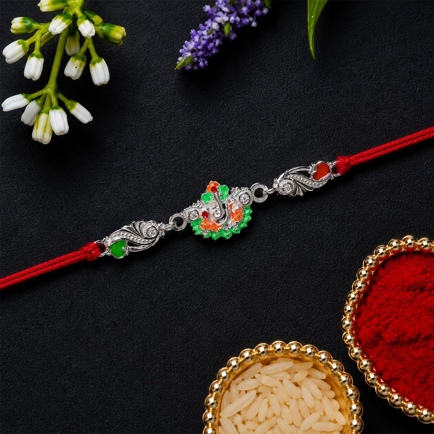 Side profile of stylish silver Ganesh charm rakhi