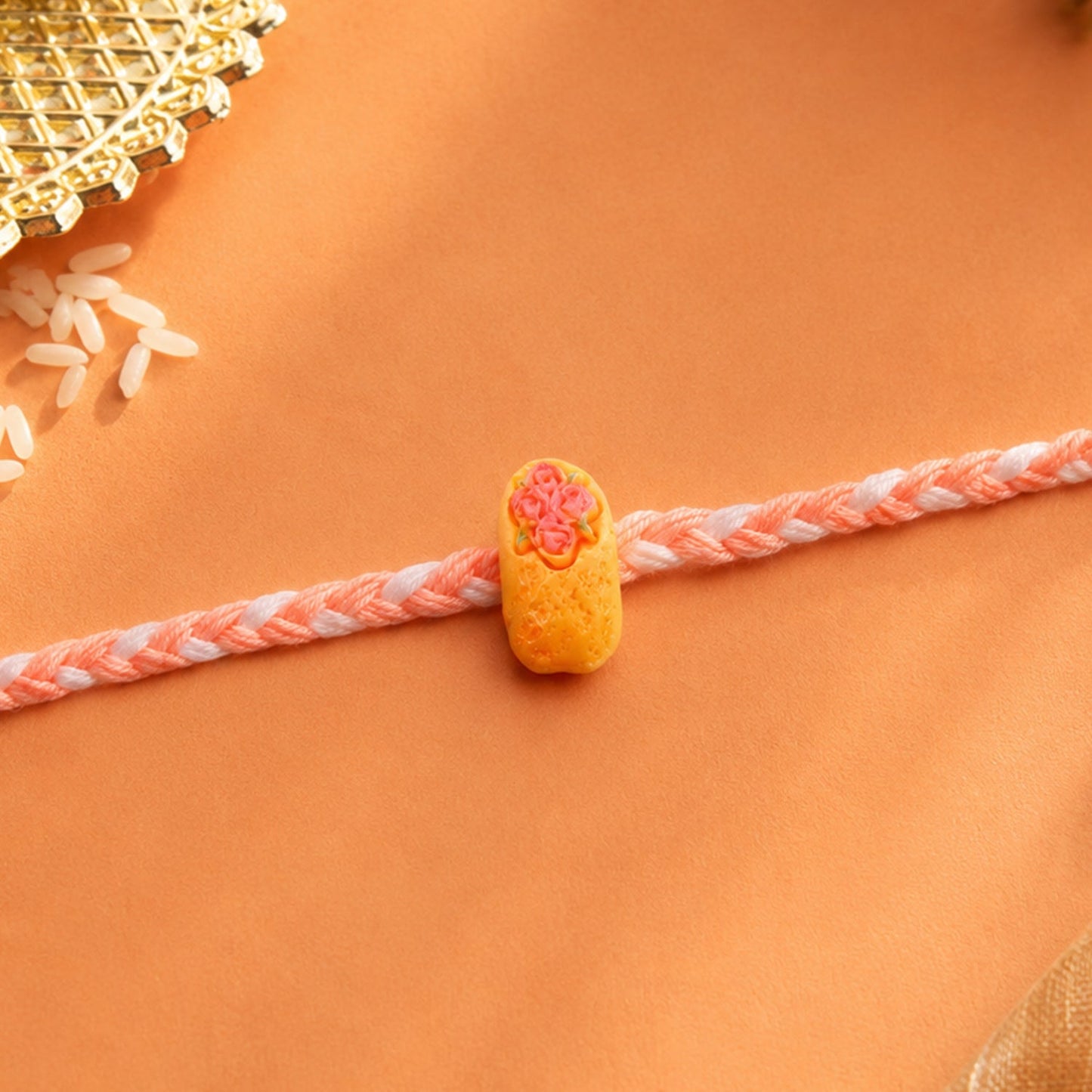 Side view of the Kids Rakhi, highlighting the intricate braided thread.