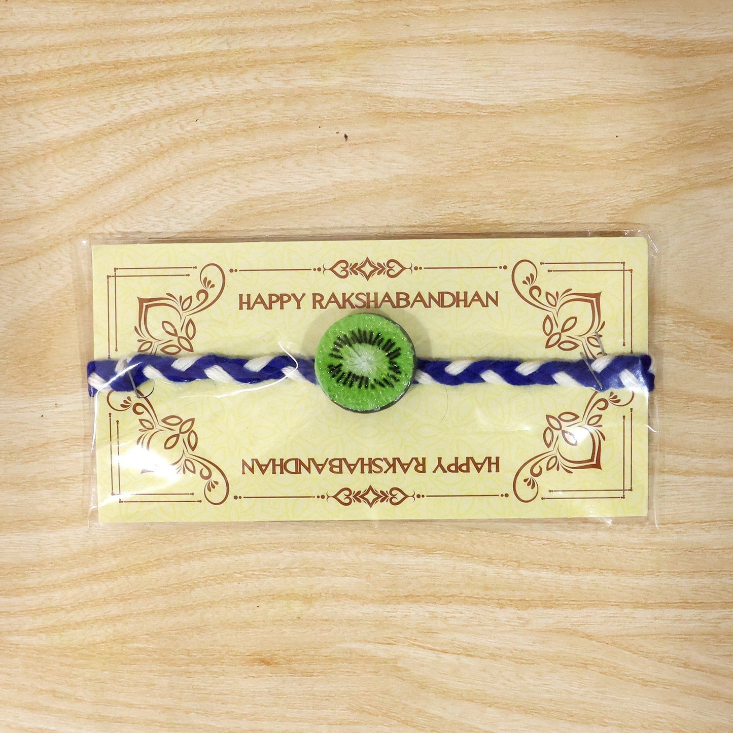 Gift-ready packaged kiwi charm braided thread rakhi for Raksha Bandhan