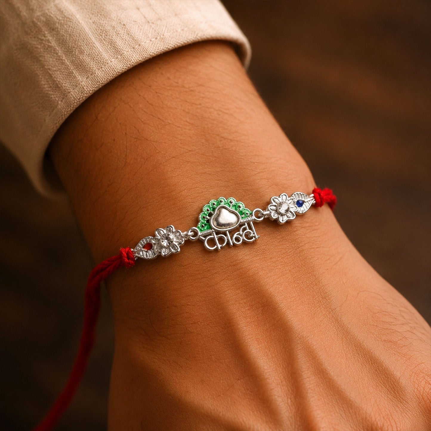 Designer Rakhi with silver charm and colorful thread