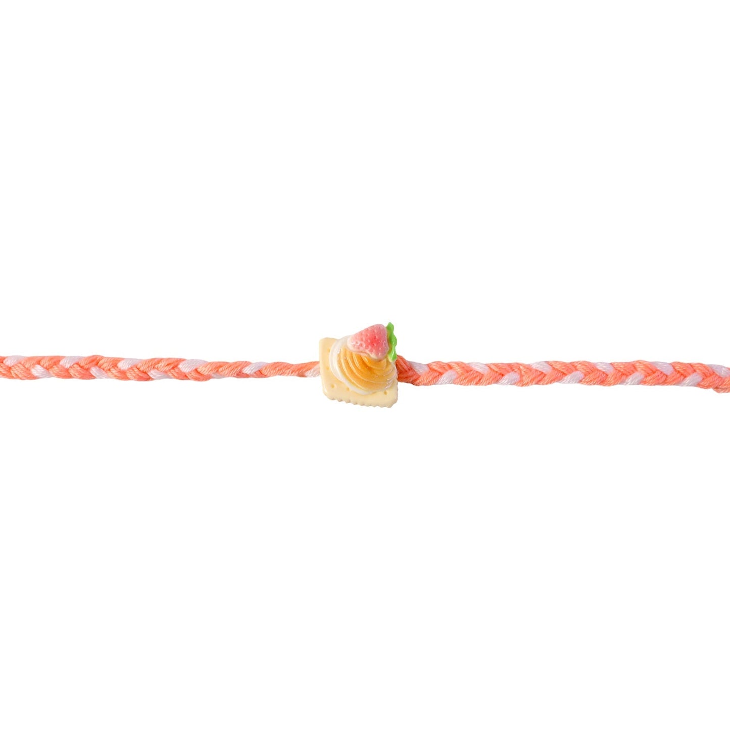Side view of braided thread Rakhi with strawberry charm